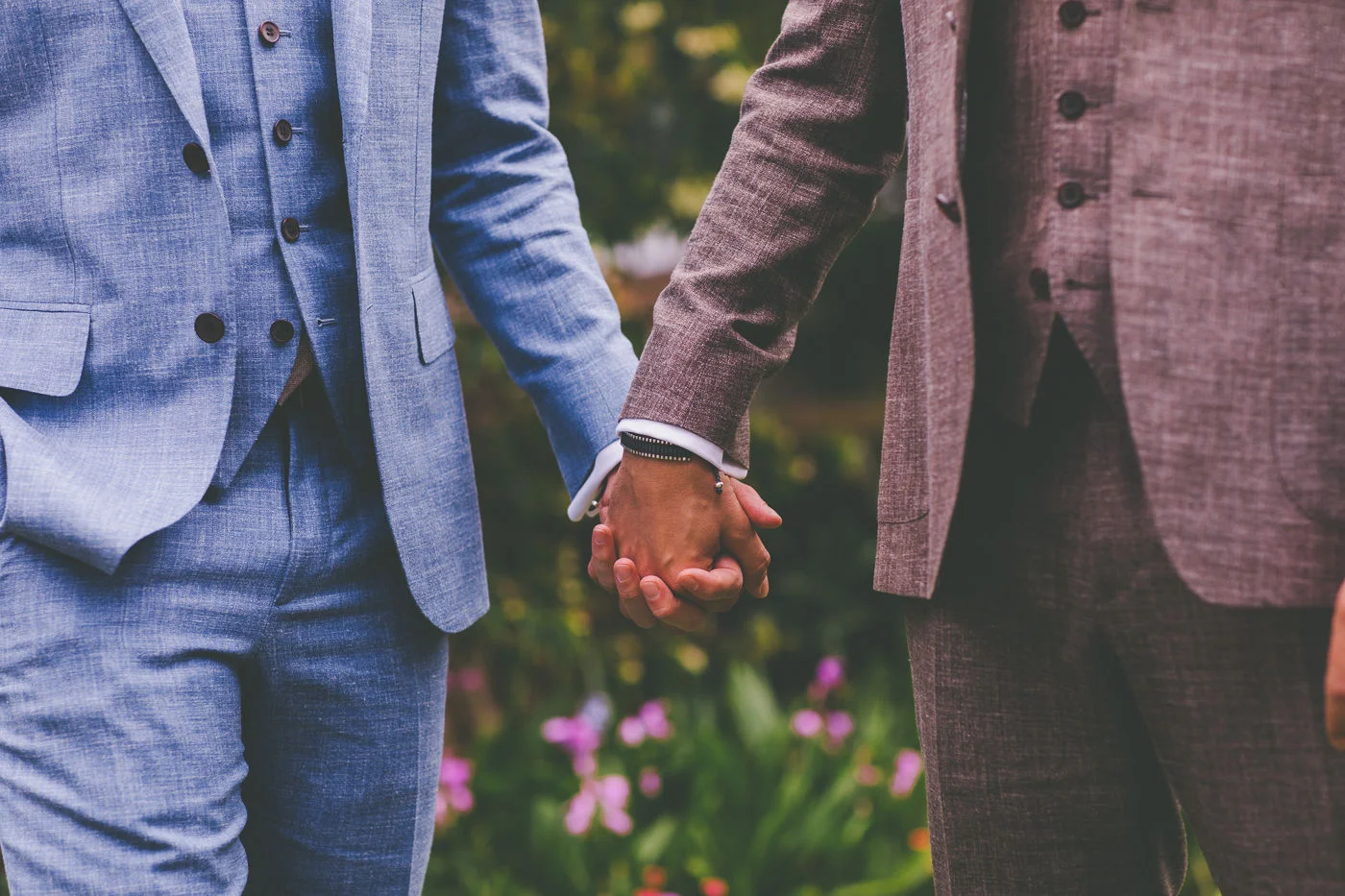 Two grooms holding hands. Same sex wedding Sydney.