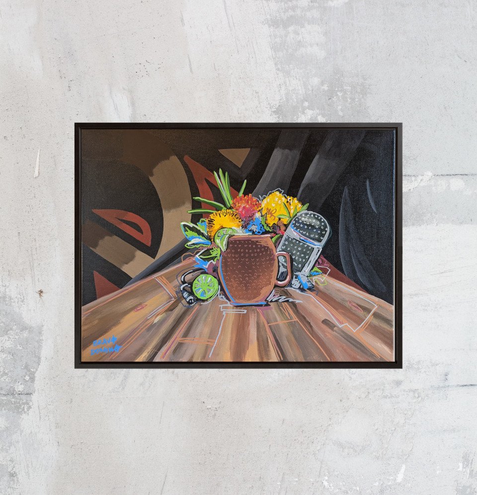 Framed Street art still life painting with copper mug, vintage microphone, and flowers on wood table with a graffiti background on grey wall