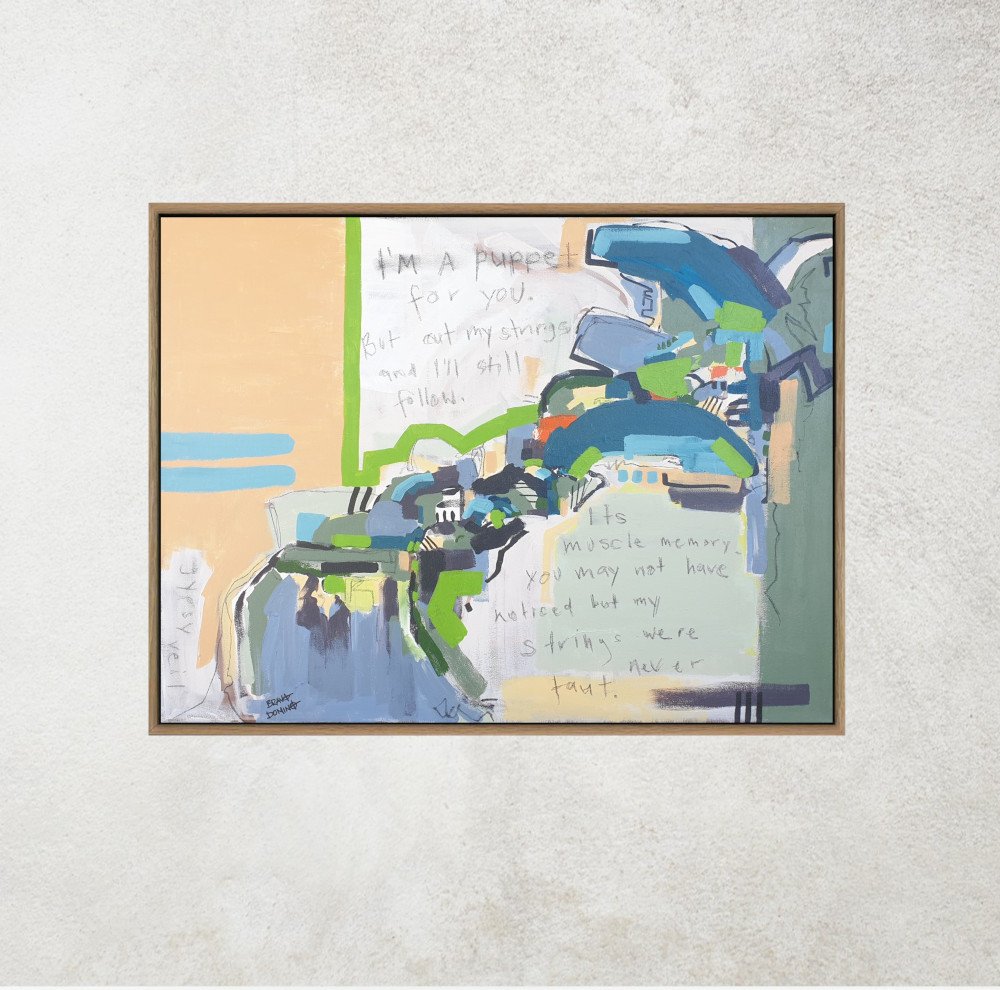 Framed abstract landscape with text on wall