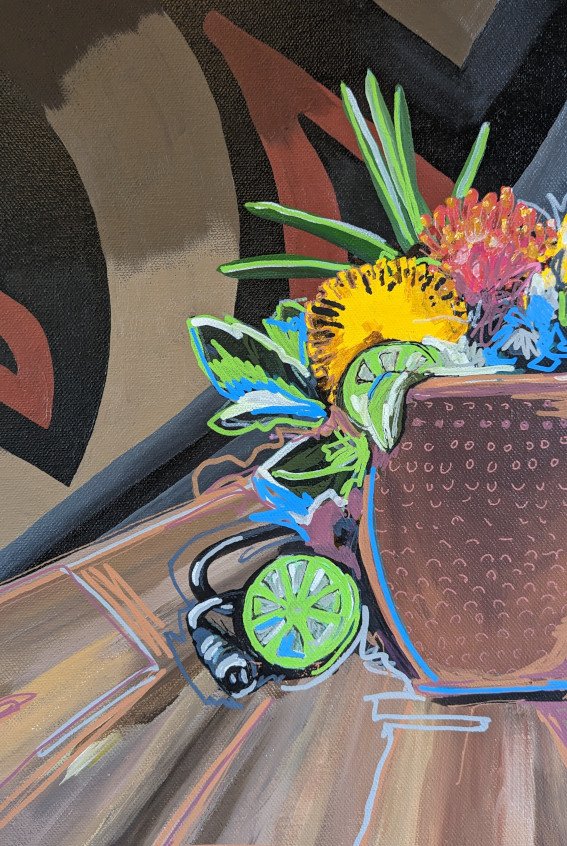 Close up details of Street art still life painting with copper mug, vintage microphone, and flowers on wood table with a graffiti background