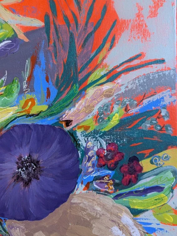 Close up details of an expressionist bouquet of flowers on a fluoro red background with a variety of florals and leaves
