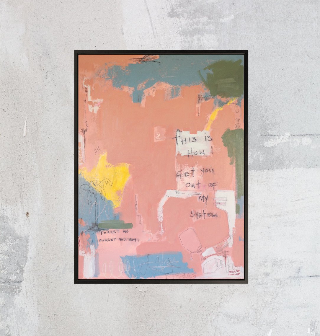 Framed abstract pink blue and green artwork with text on grey textured wall