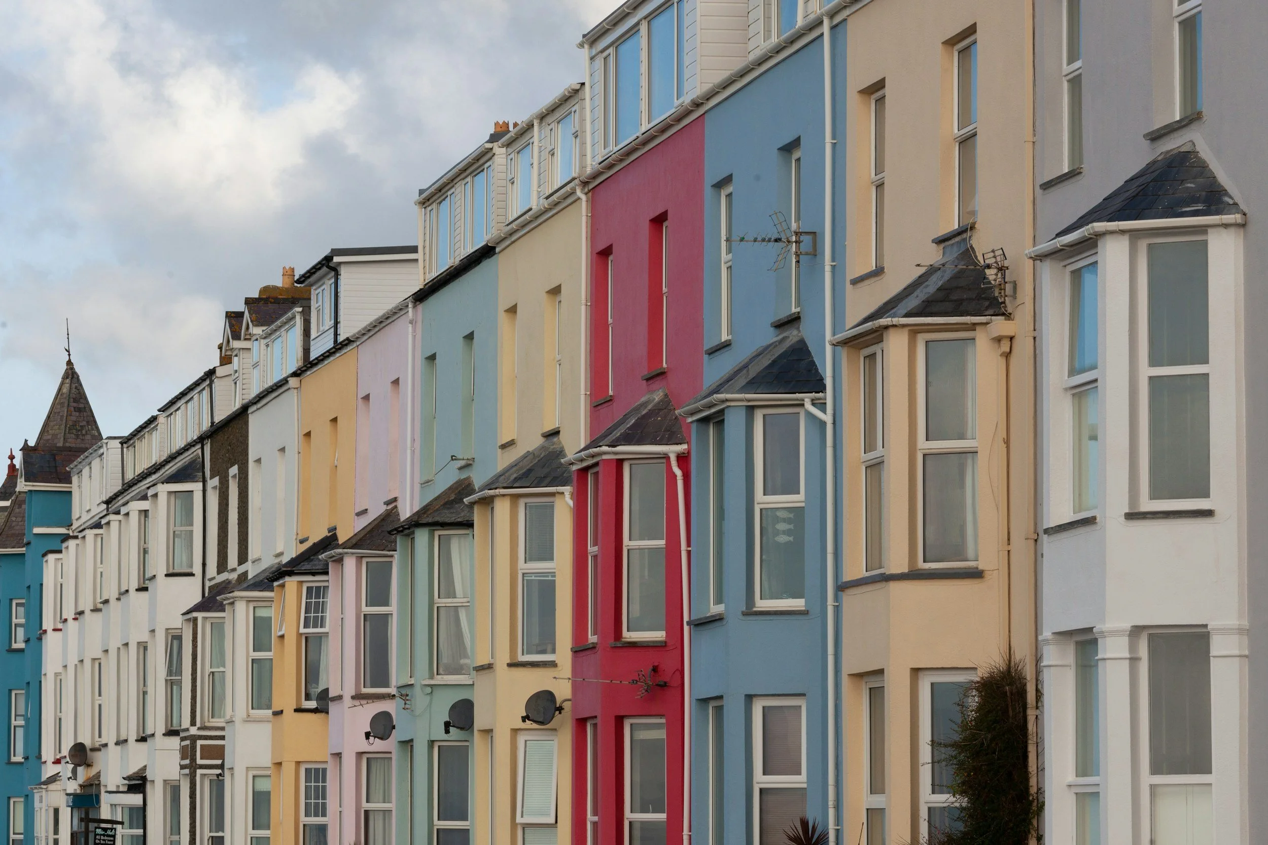 Image of a row of colourful holiday homes