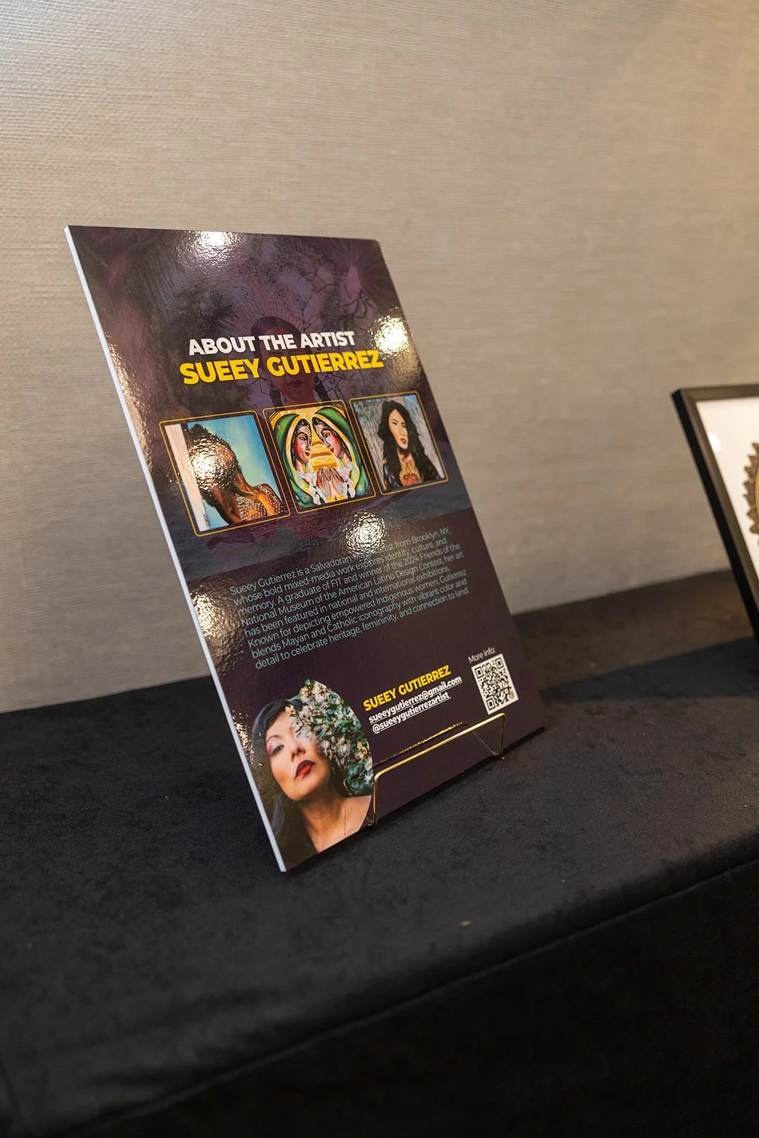 Information card about artist Suey Gutierrez with three artist images and contact details.