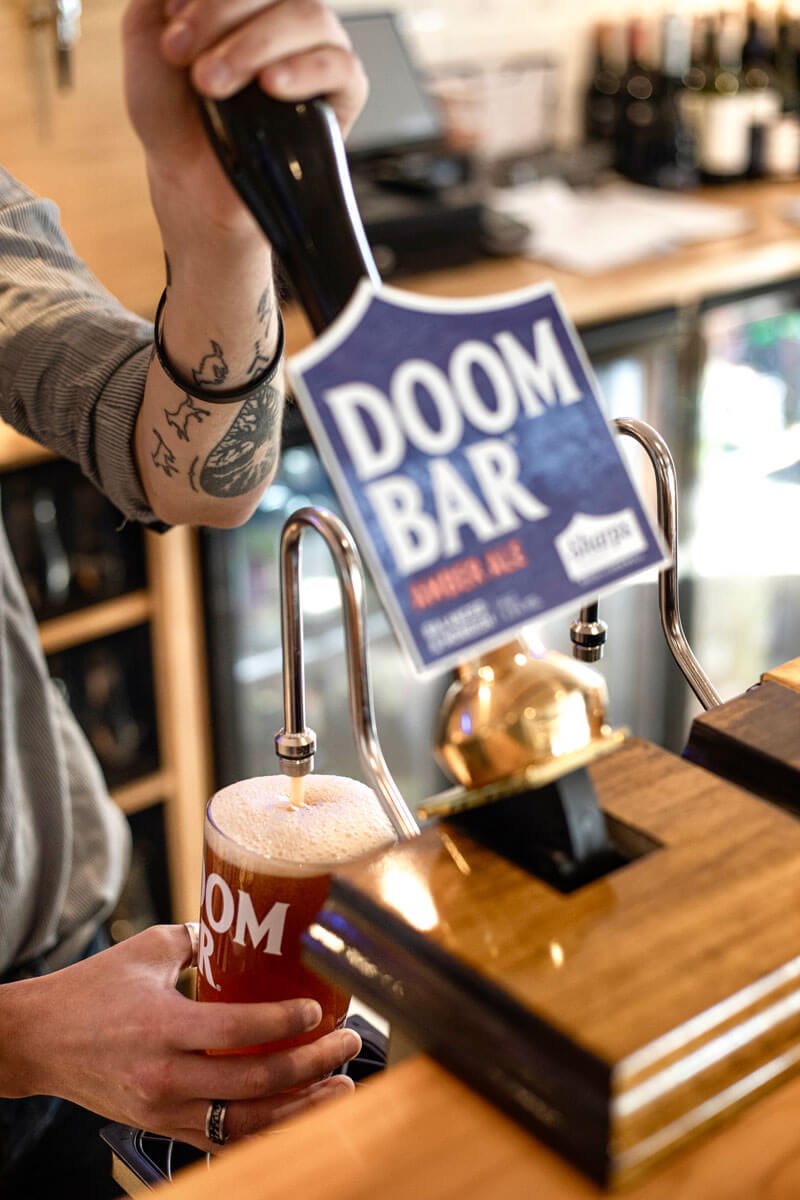 Pouring a pint of Doom Bar