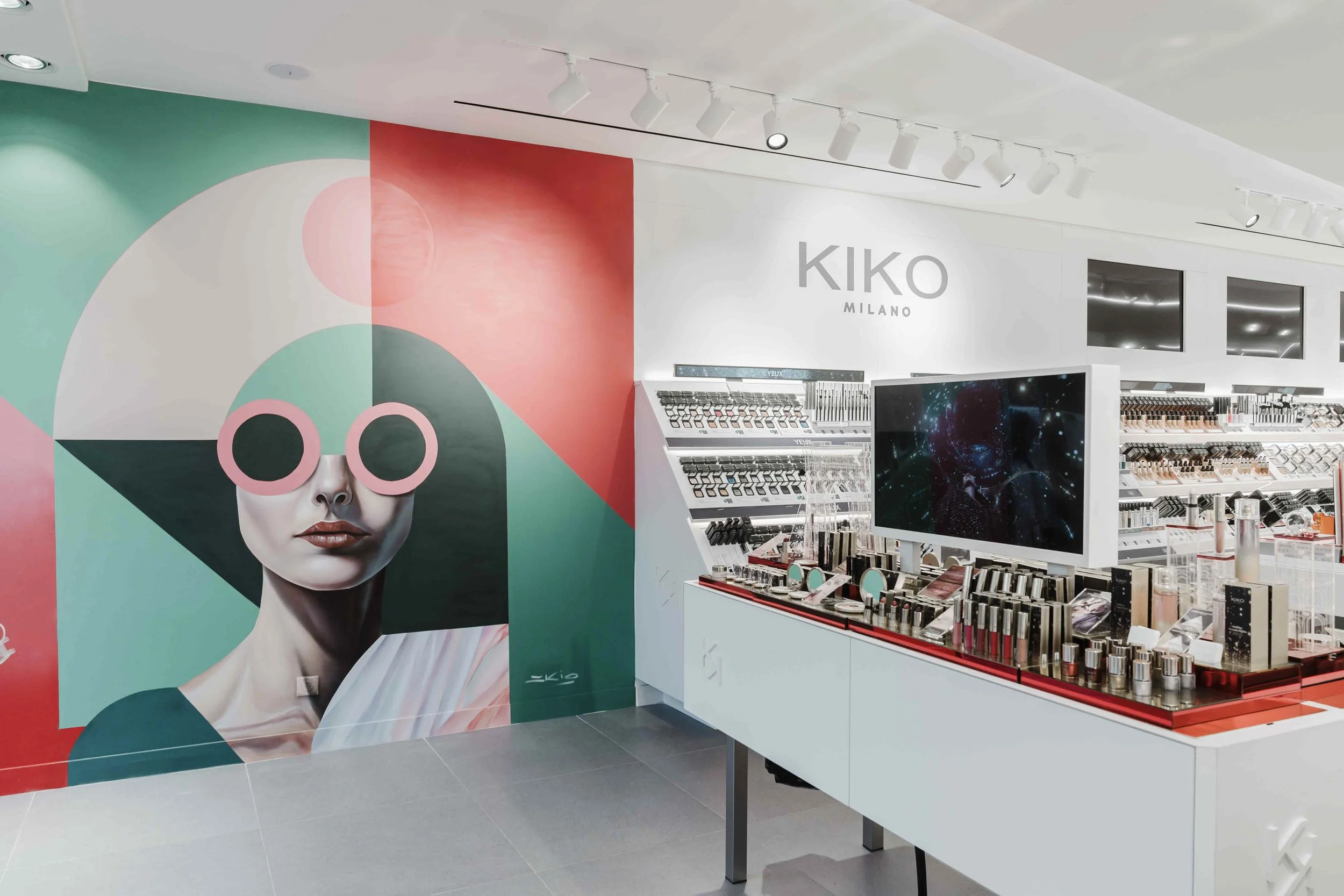 Interior view of the new Kiko Milano store in Paris, showcasing the completed mural and modern design.