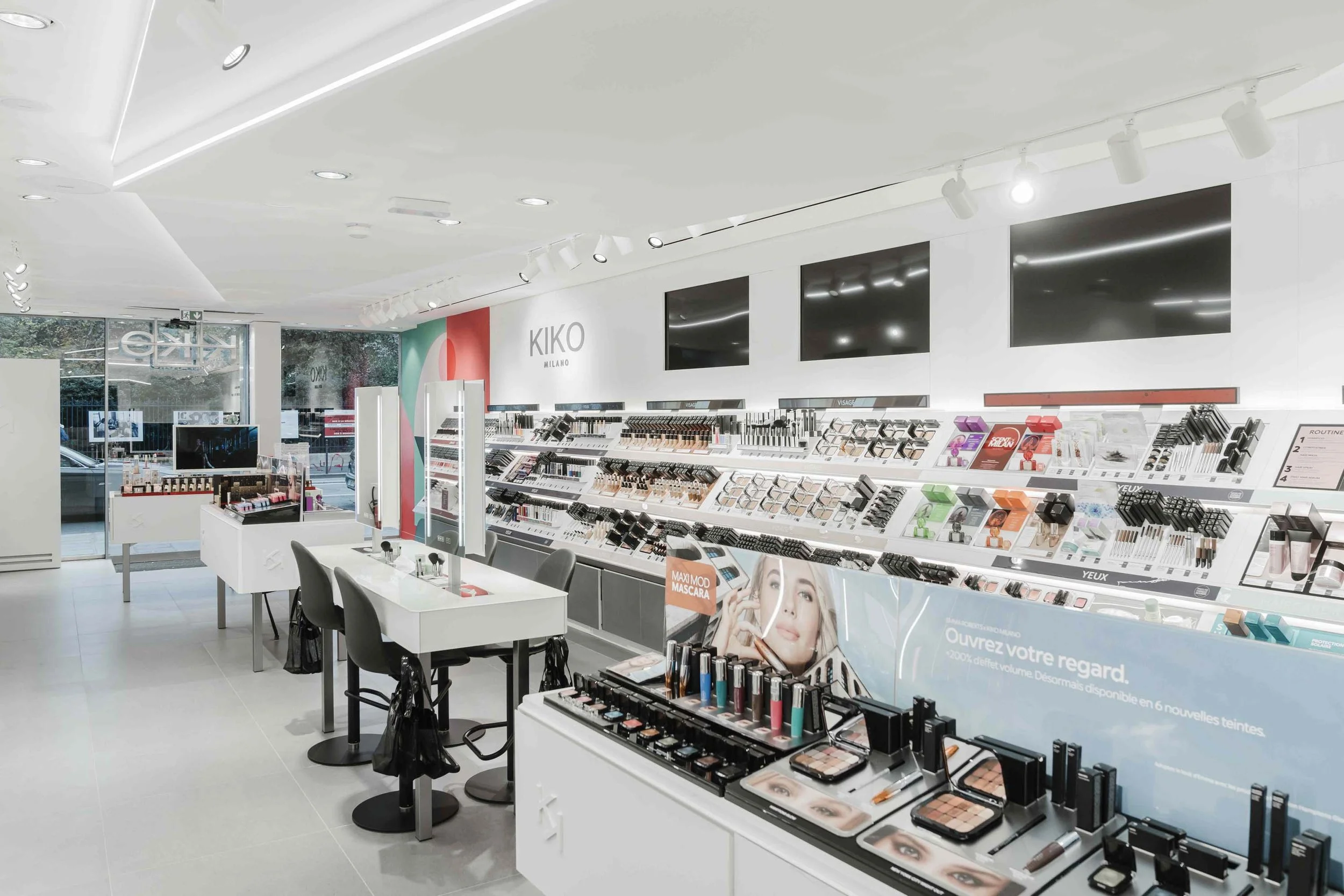 Interior view of the new Kiko Milano store in Paris, showcasing the completed mural and modern design.