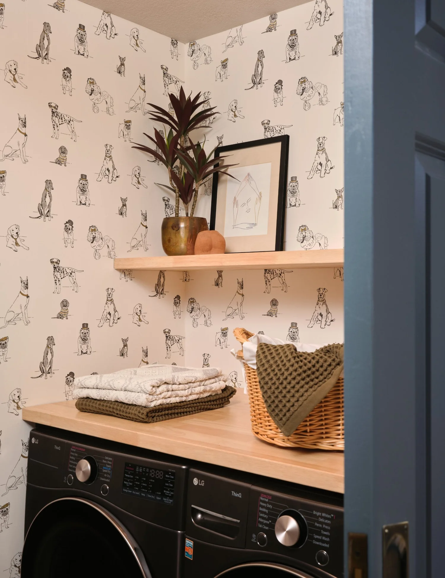 Butcher block counter over the washer and dryer against the dog wallpaper