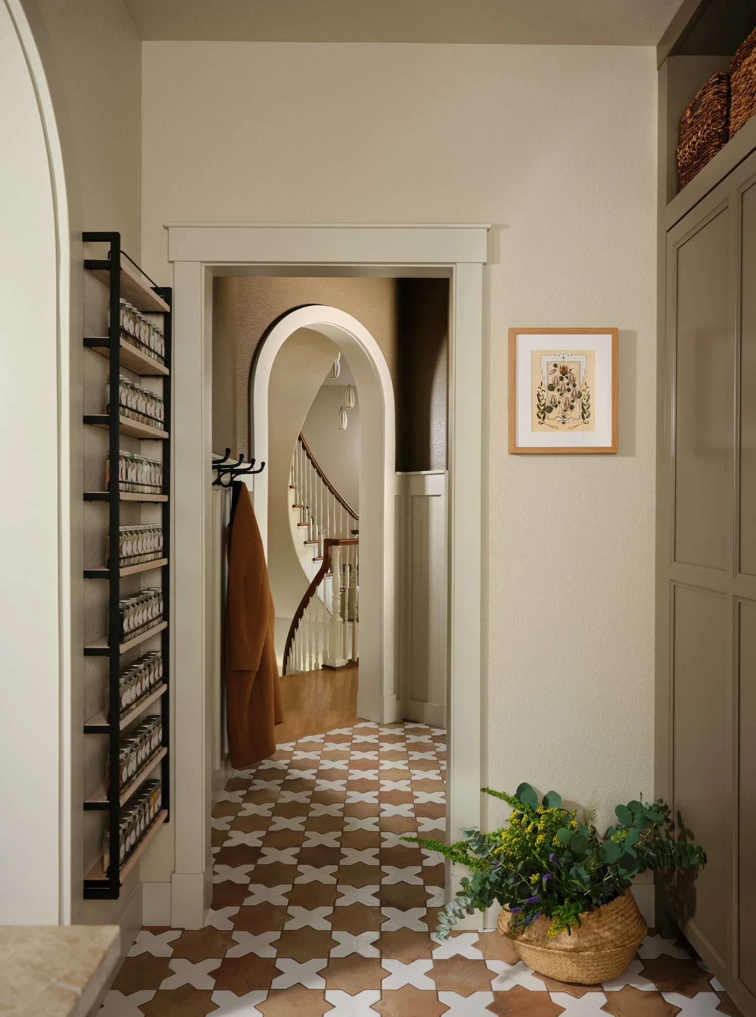 Looking from the pantry through the mudroom arch to the curved staircase