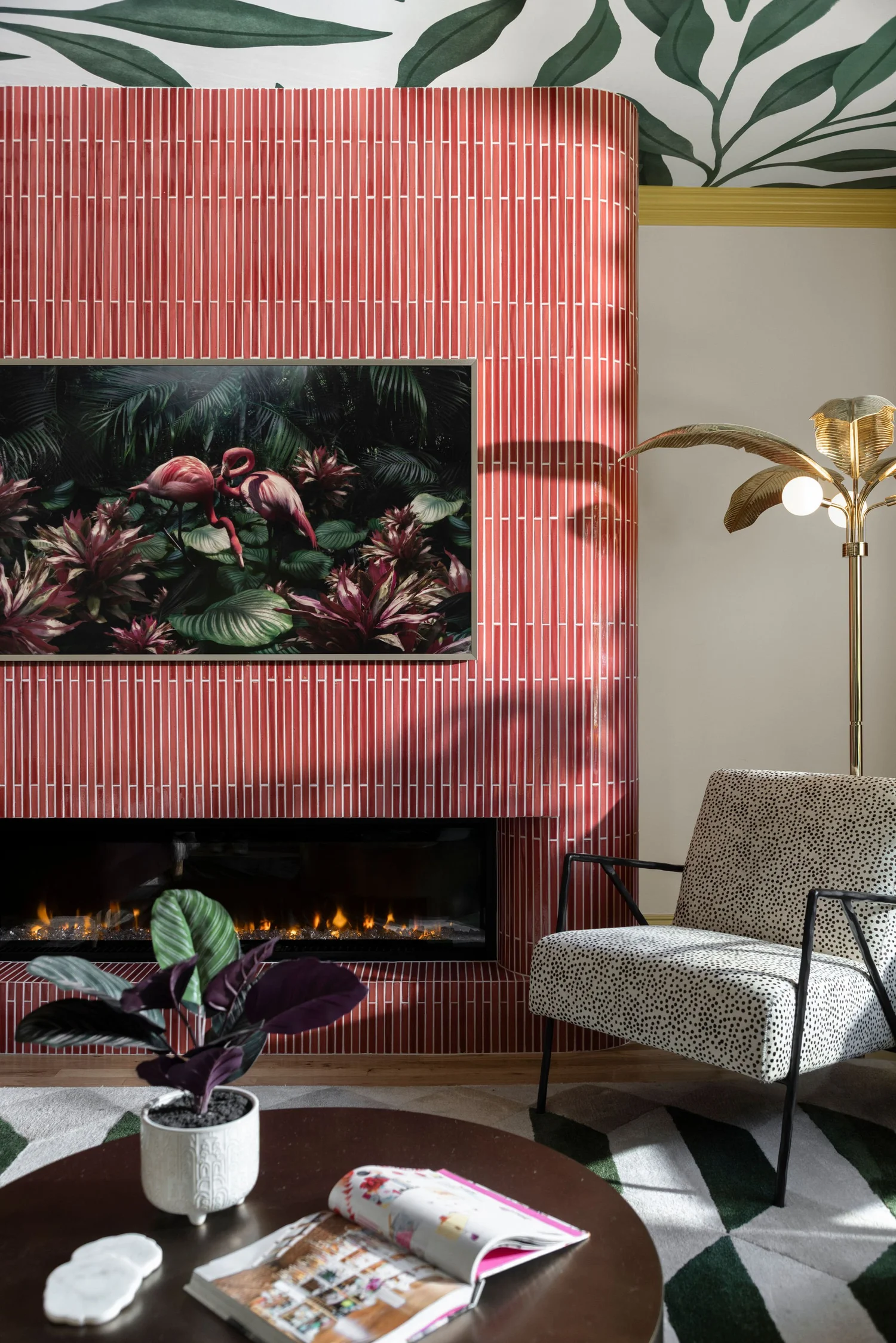 Pink tile fireplace with mitered edges and the art television
