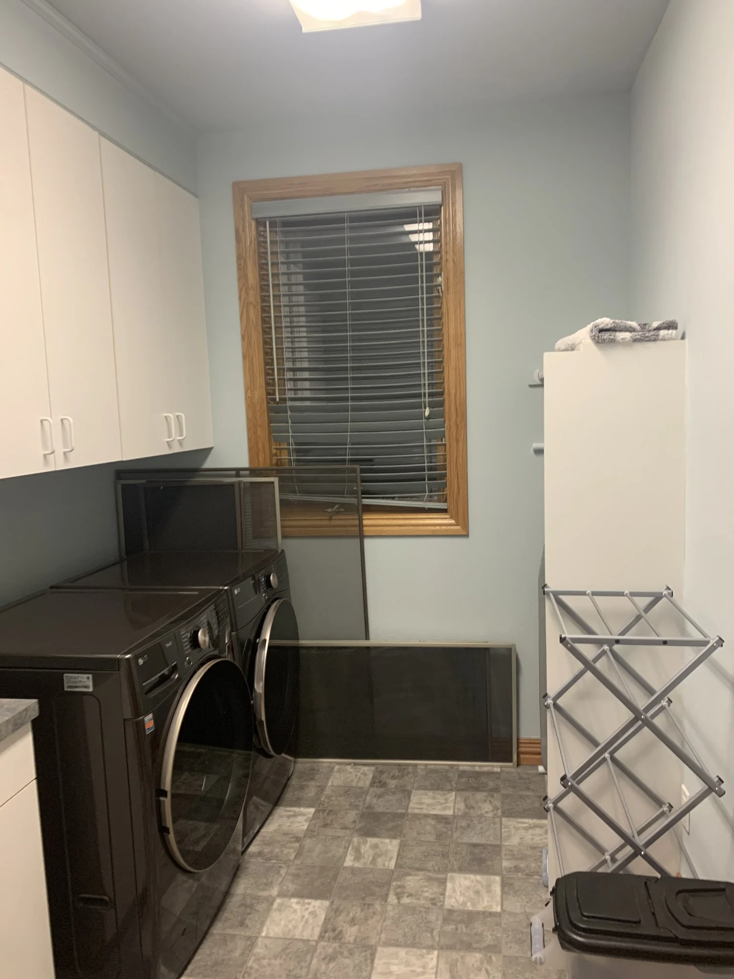 The original laundry room with the washer and dryer under the window