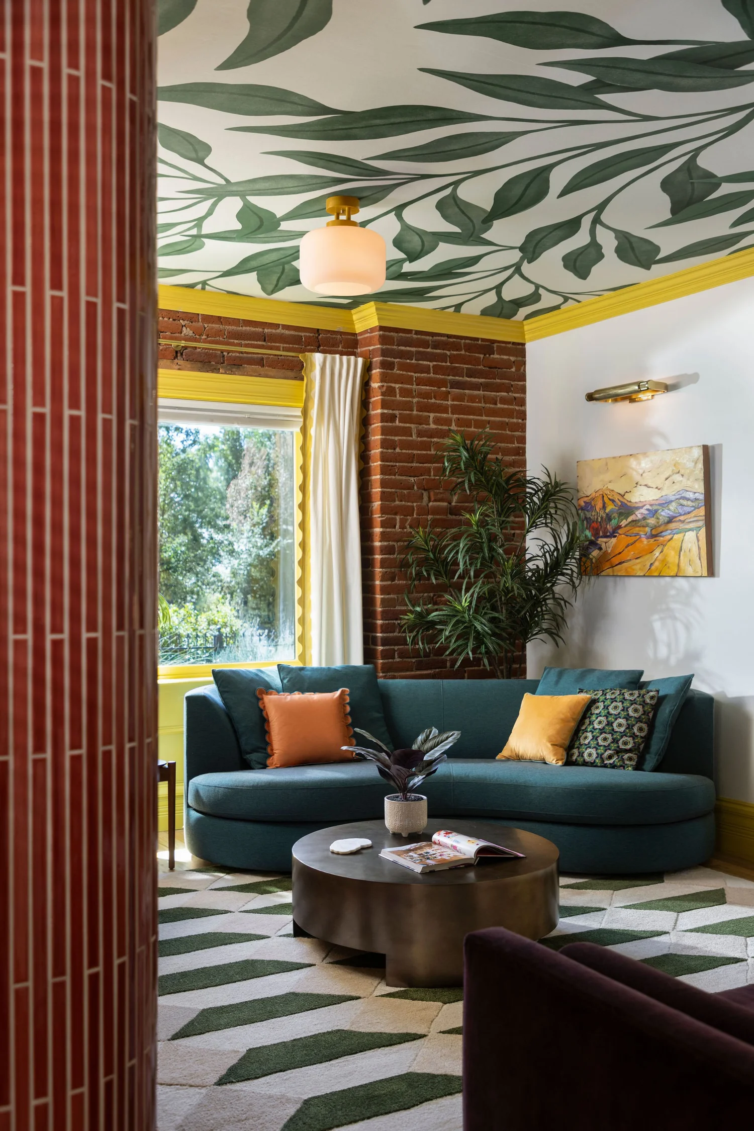 Seating nook beneath the leaf mural ceiling