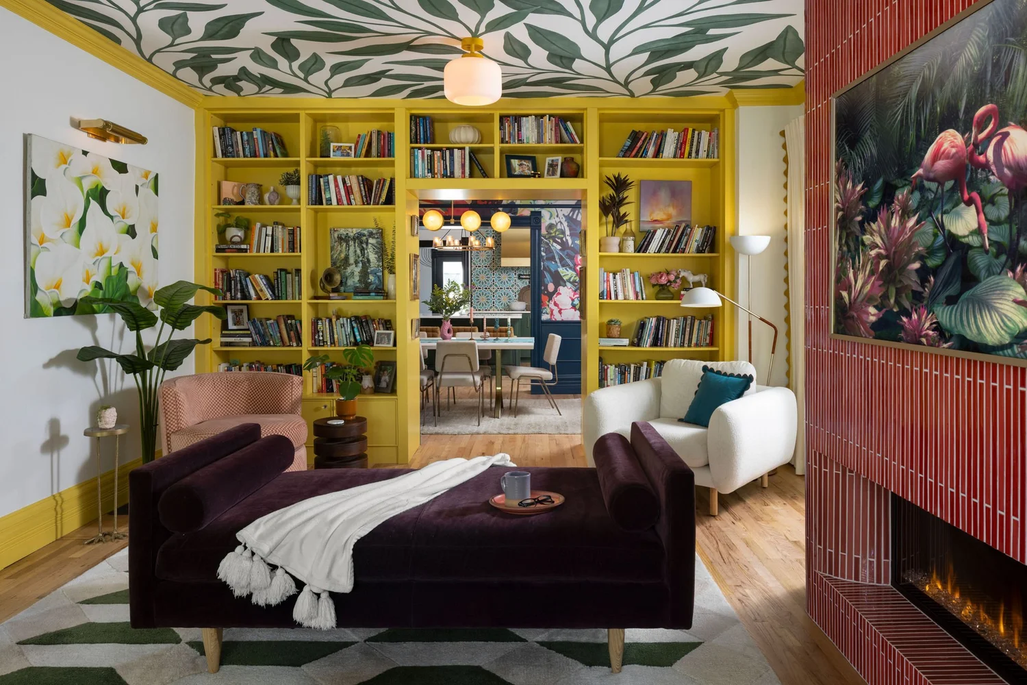 Yellow built-in bookcases framing the entry to the dining room