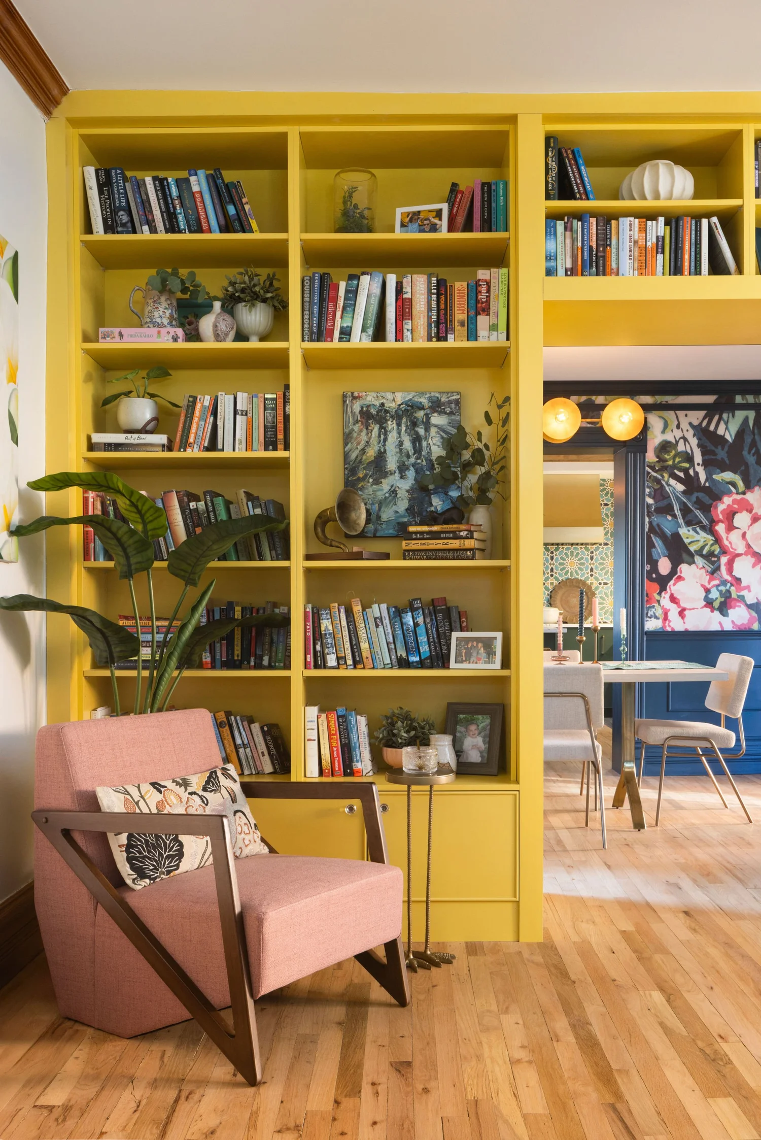 Yellow shelves beside the dining room doorway