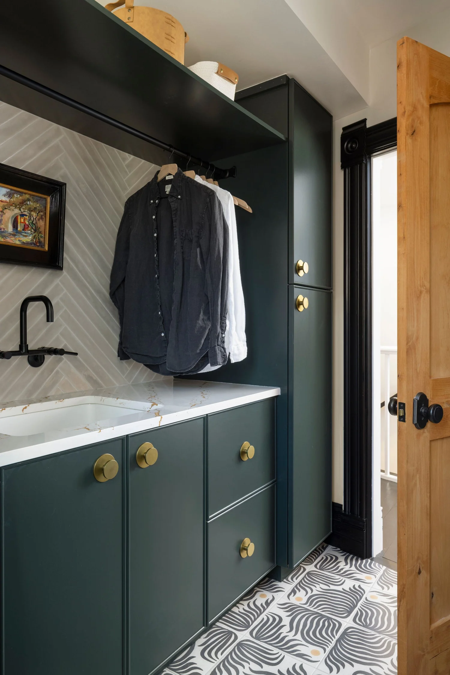 Laundry cabinetry with the hanging bar and open shelf