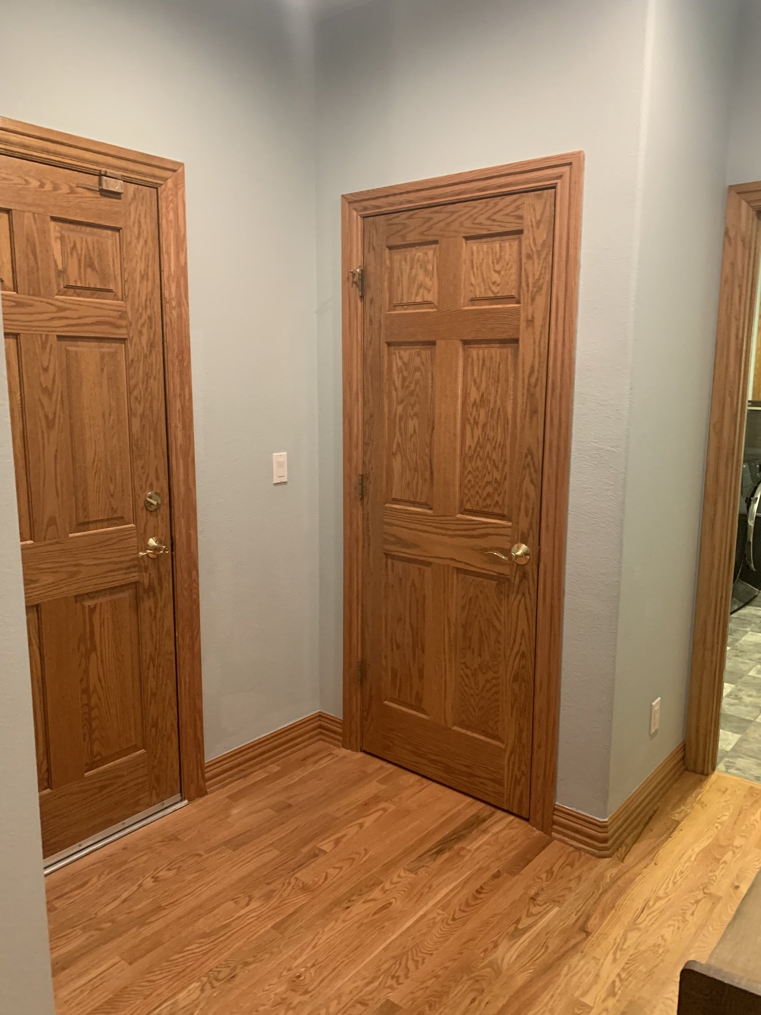 The original mudroom with red oak doors and trim