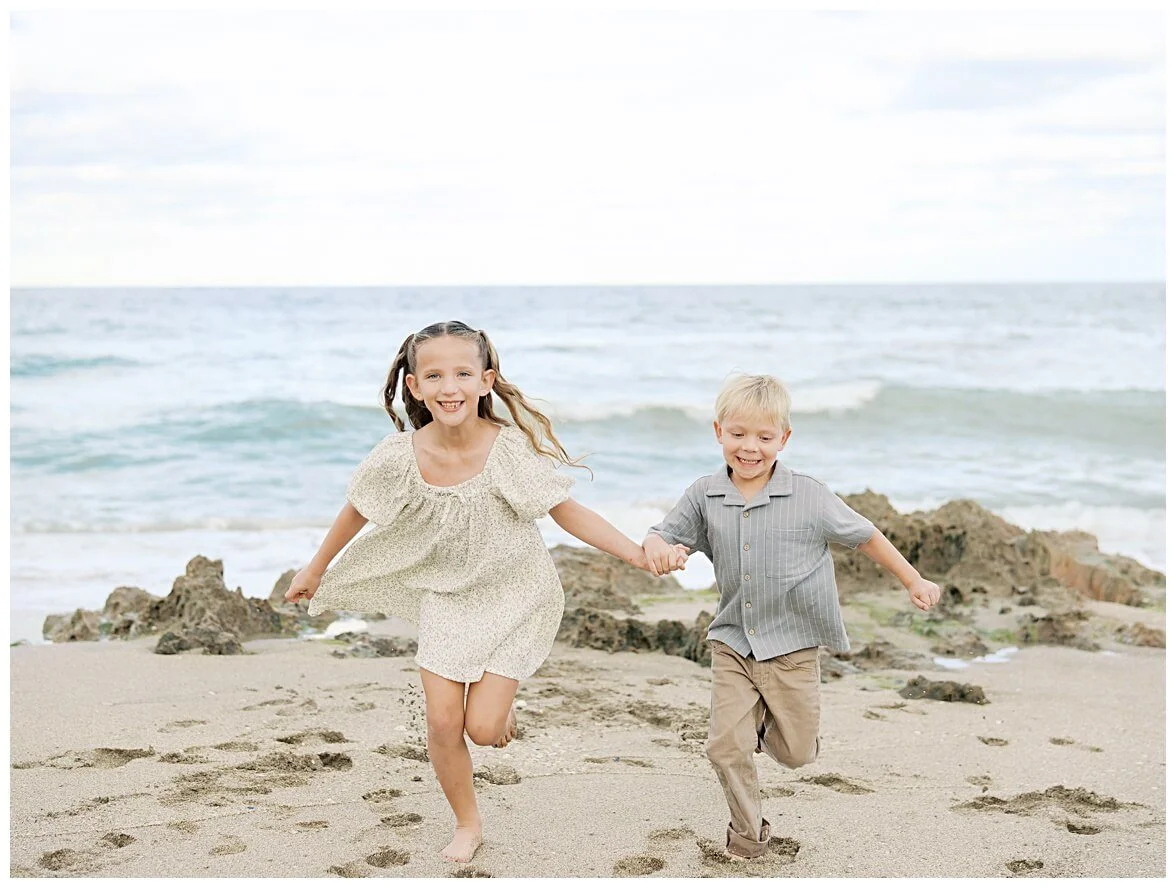 kids running on the beach during a family session