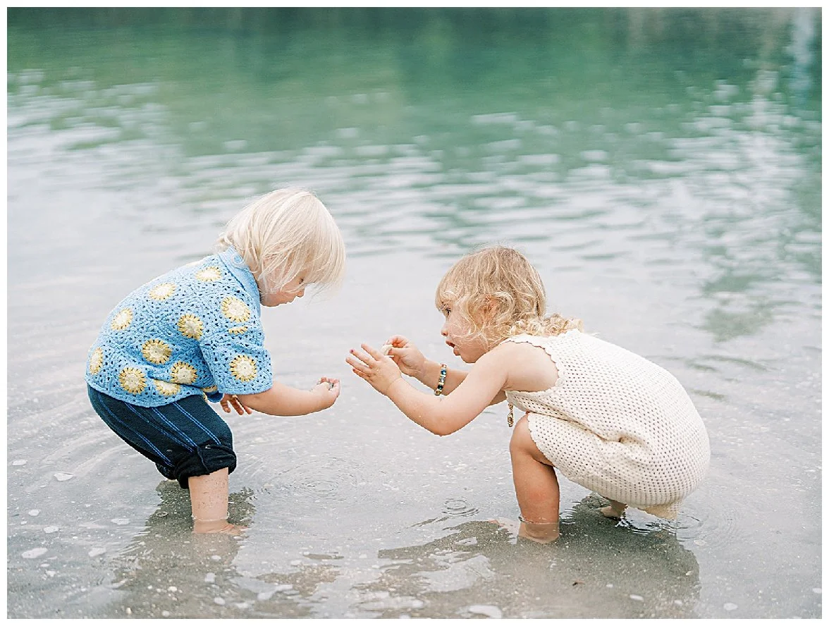 kids playing in the water at a family session