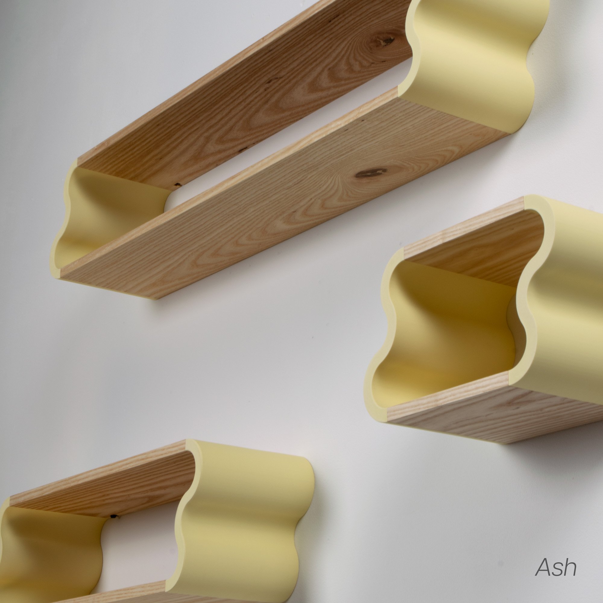 Detail photo of ash and pastel yellow Squiggle Floating Shelves | Pastel Accented Cherry and Ash Hardwood Shelving | Modular Display & Storage | Floating Shelving | Wall Shelf
