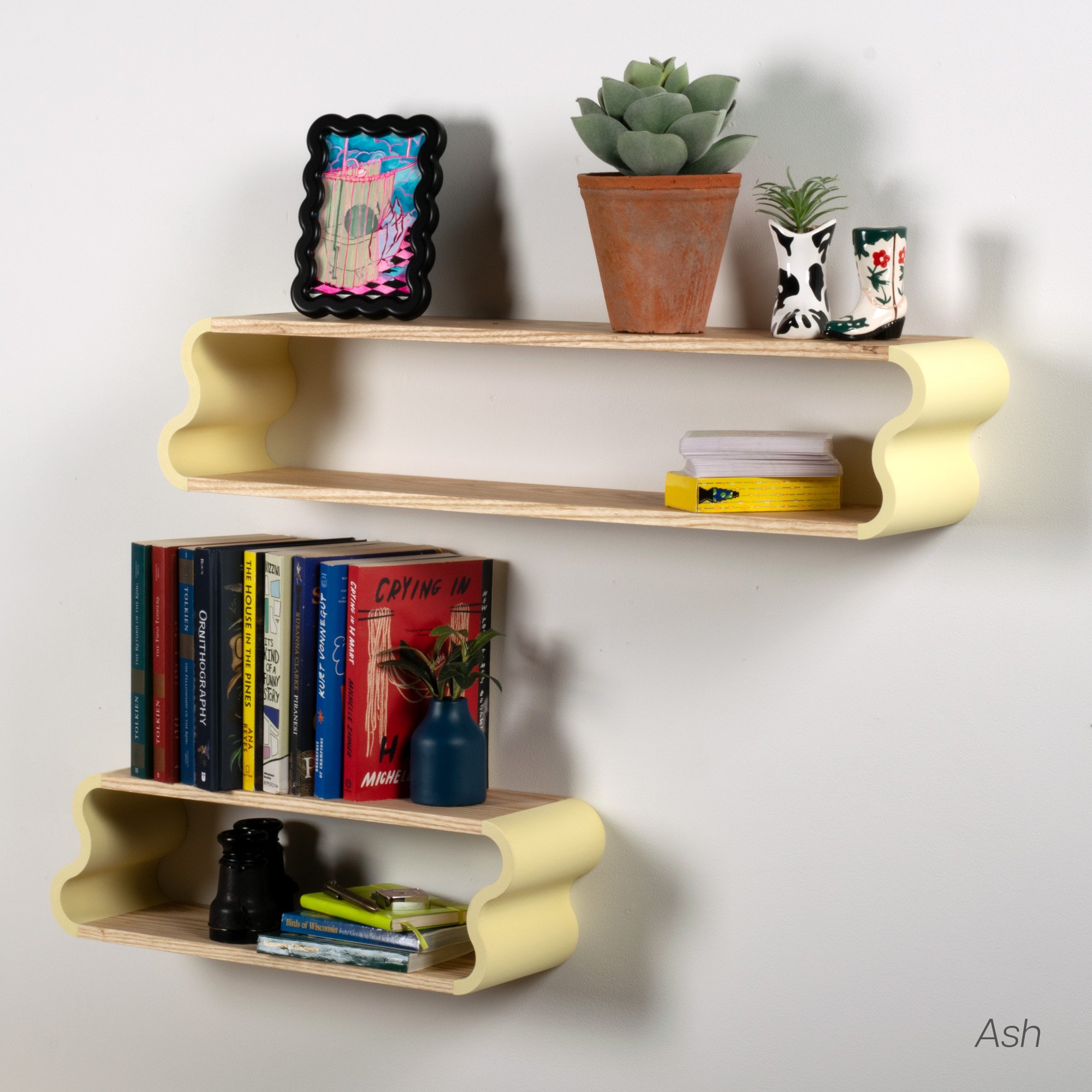In use photo of ash and pastel yellow Squiggle Floating Shelves | Pastel Accented Cherry and Ash Hardwood Shelving | Modular Display & Storage | Floating Shelving | Wall Shelf