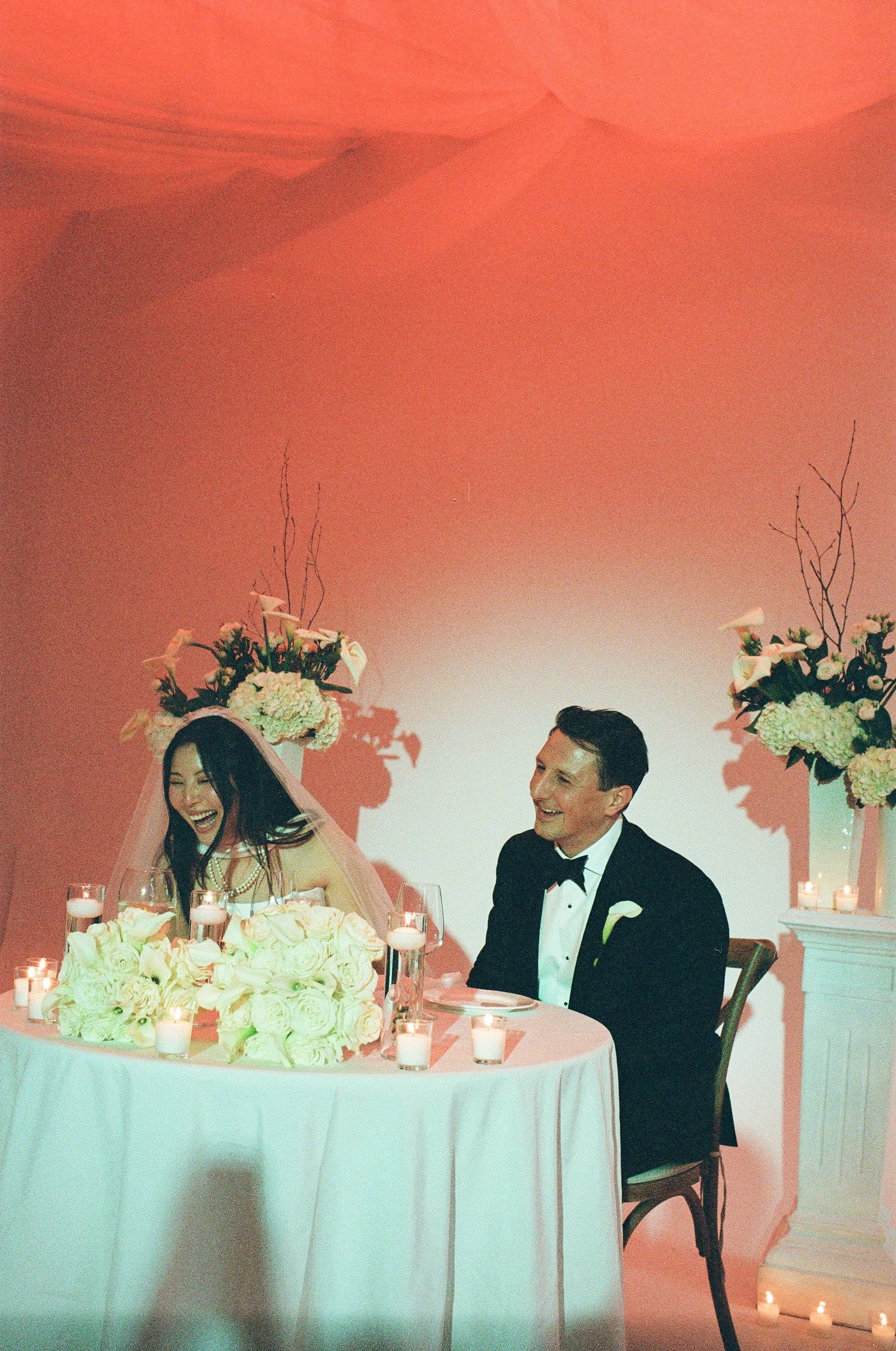 NYC Wedding Photographer, bride and groom laughing together during reception