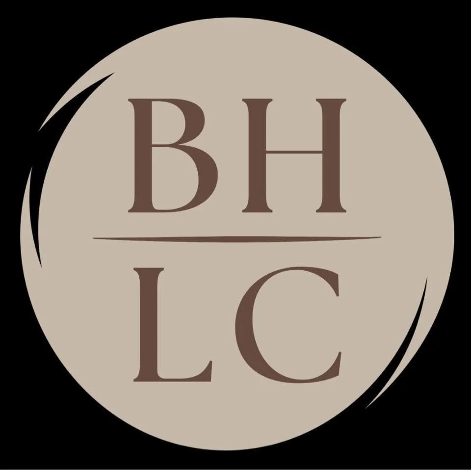 A circular BHLC logo with beige background and brown text, displaying the initials 'BHLC' separated by a line, surrounded by black swooping accents.