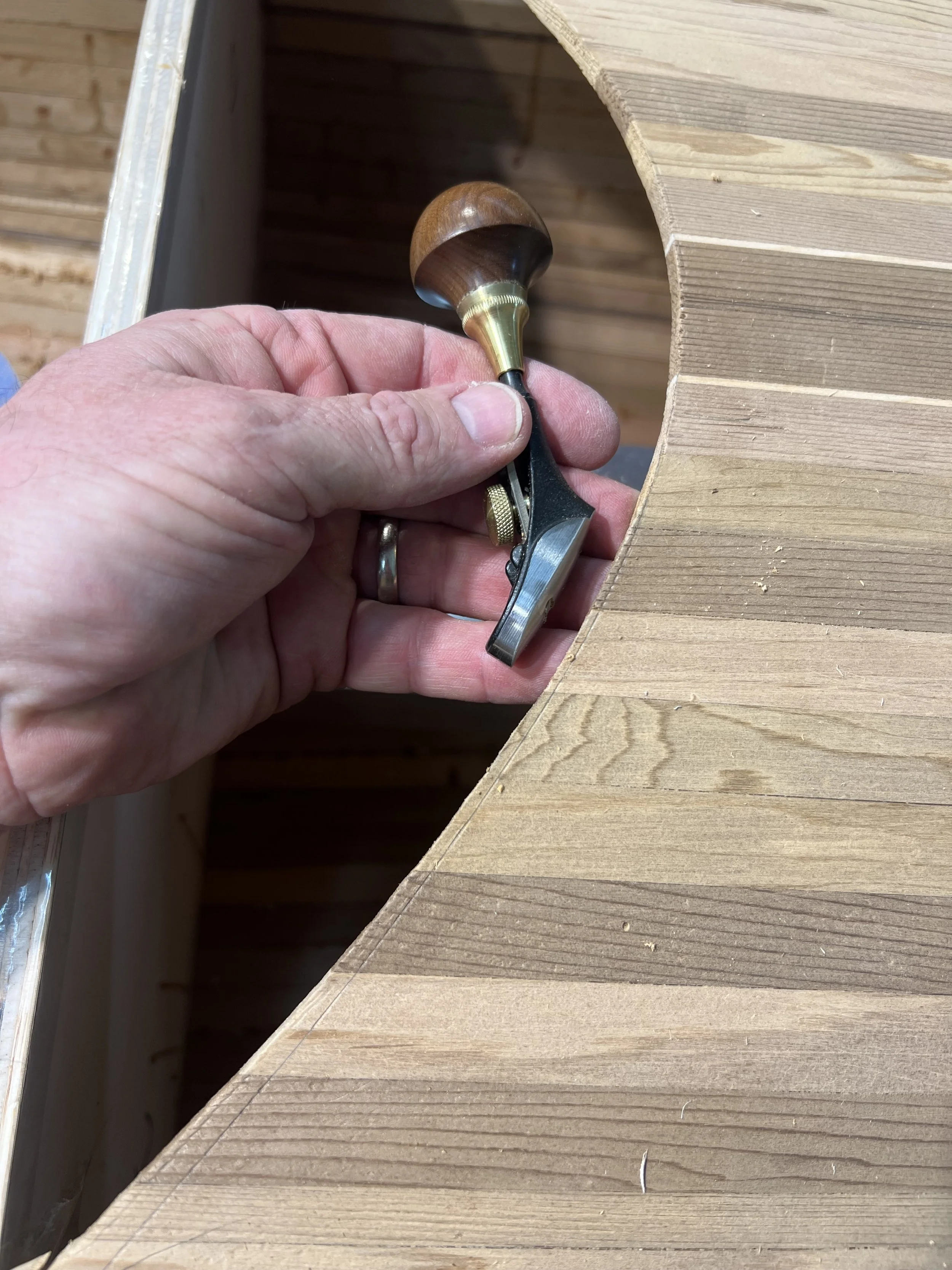 cleaning up cockpit open with double curved luthier plane.jpeg