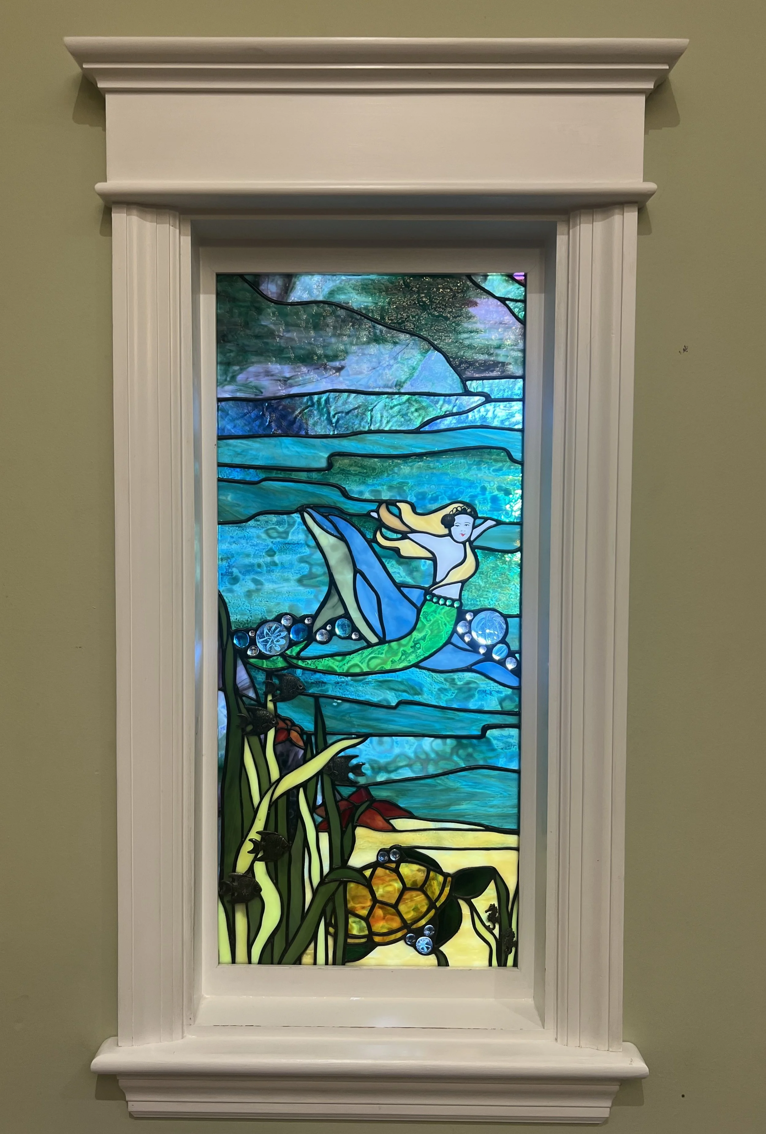 yellow mermaid stained glass east.jpeg