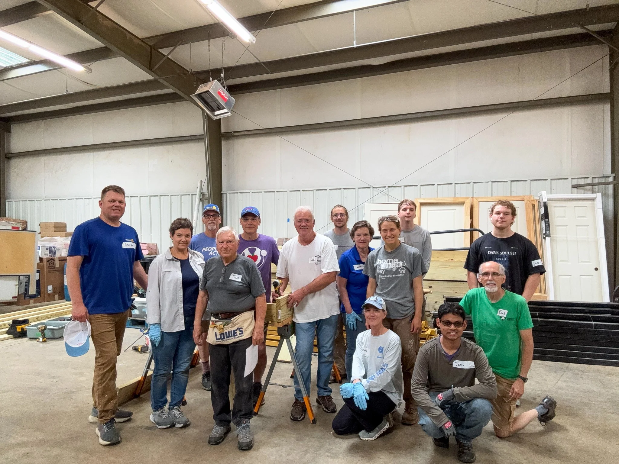  Hammer &amp; Heart volunteers gather at the program's new headquarters in Black Mountain, May 2026. 