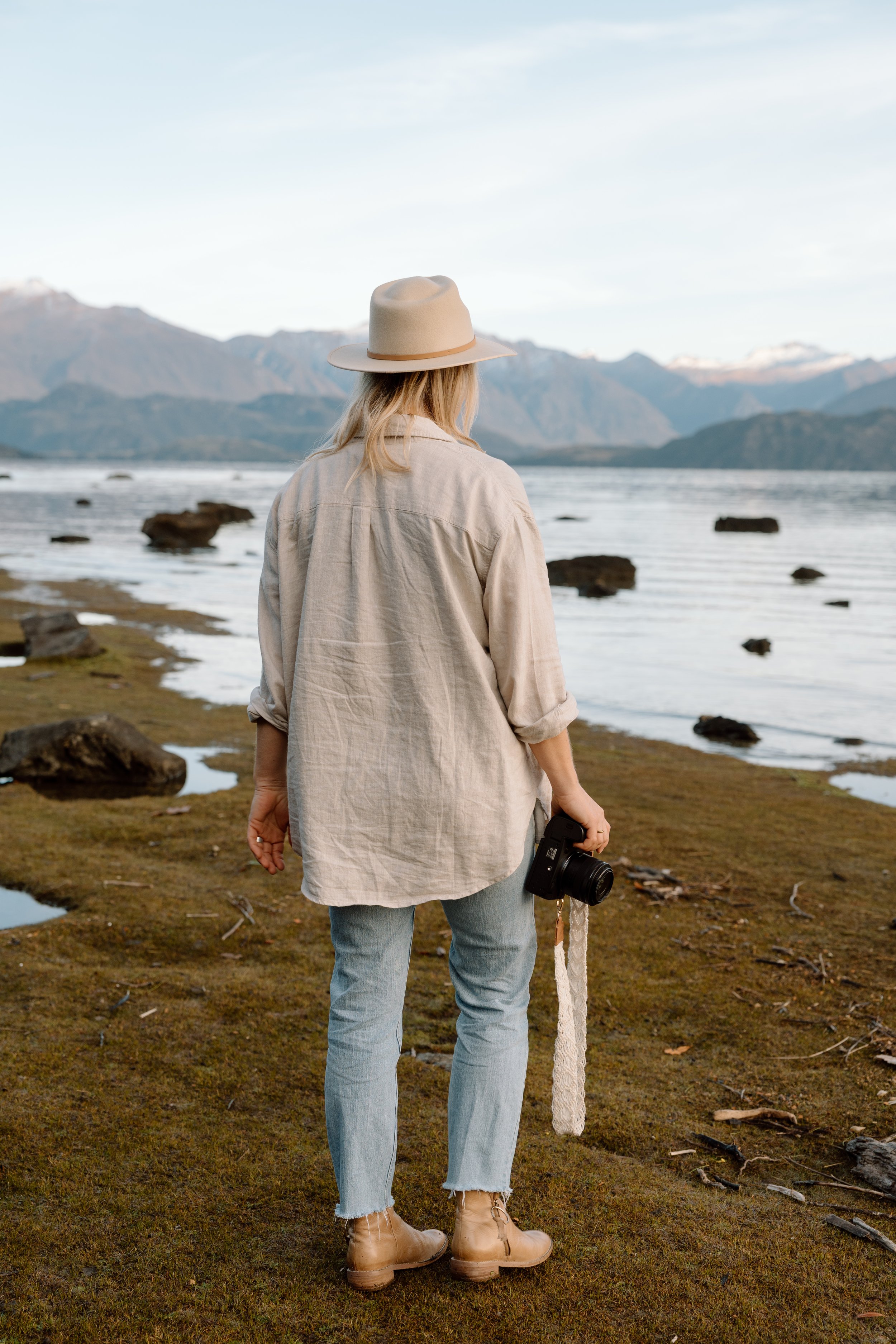 Personal branding session for a Wānaka-based female business owner, photographed outdoors with relaxed, confident posing.