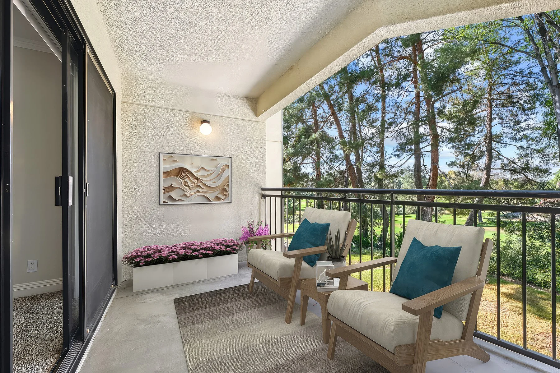 An image of our oversized patio in the  Two-Bedroom, Two-Bathroom Unit, shown with Furniture. 