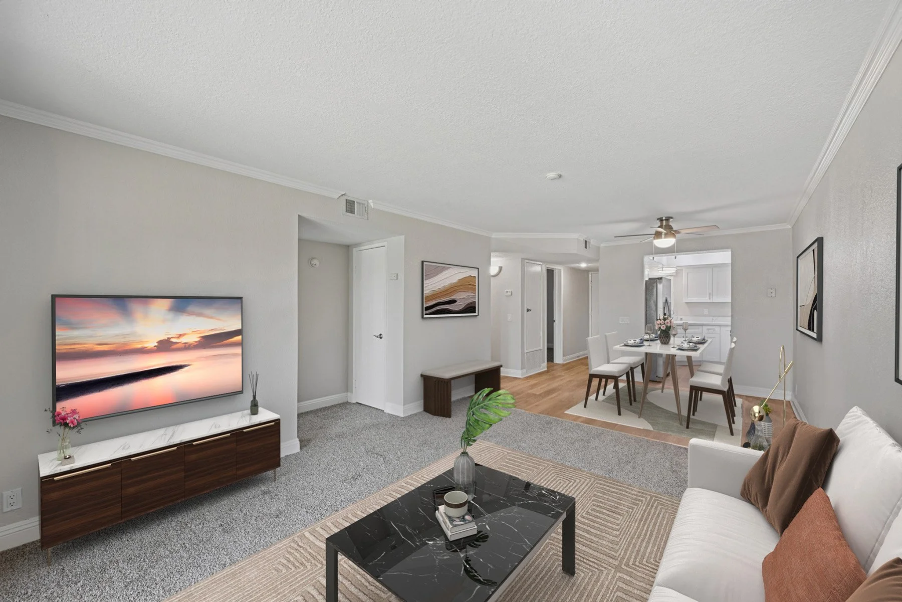 An image of our comforting living room in the  Two-Bedroom, Two-Bathroom Unit, shown with Furniture. 