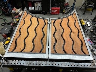 Metal frame for wooden gate.