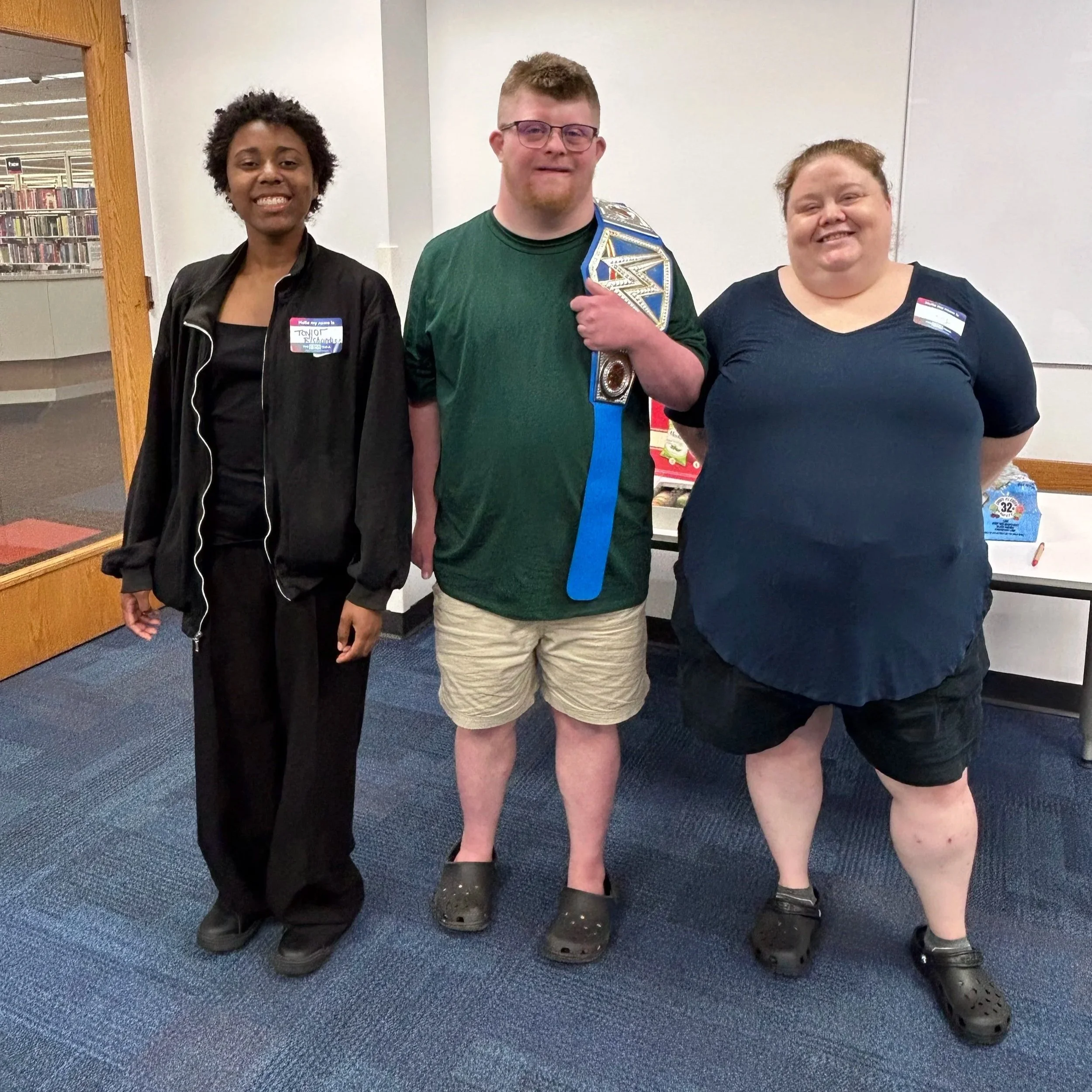 Three Voices Fellows (Taylor, Alex, and Mary) pose together at The Big Table.