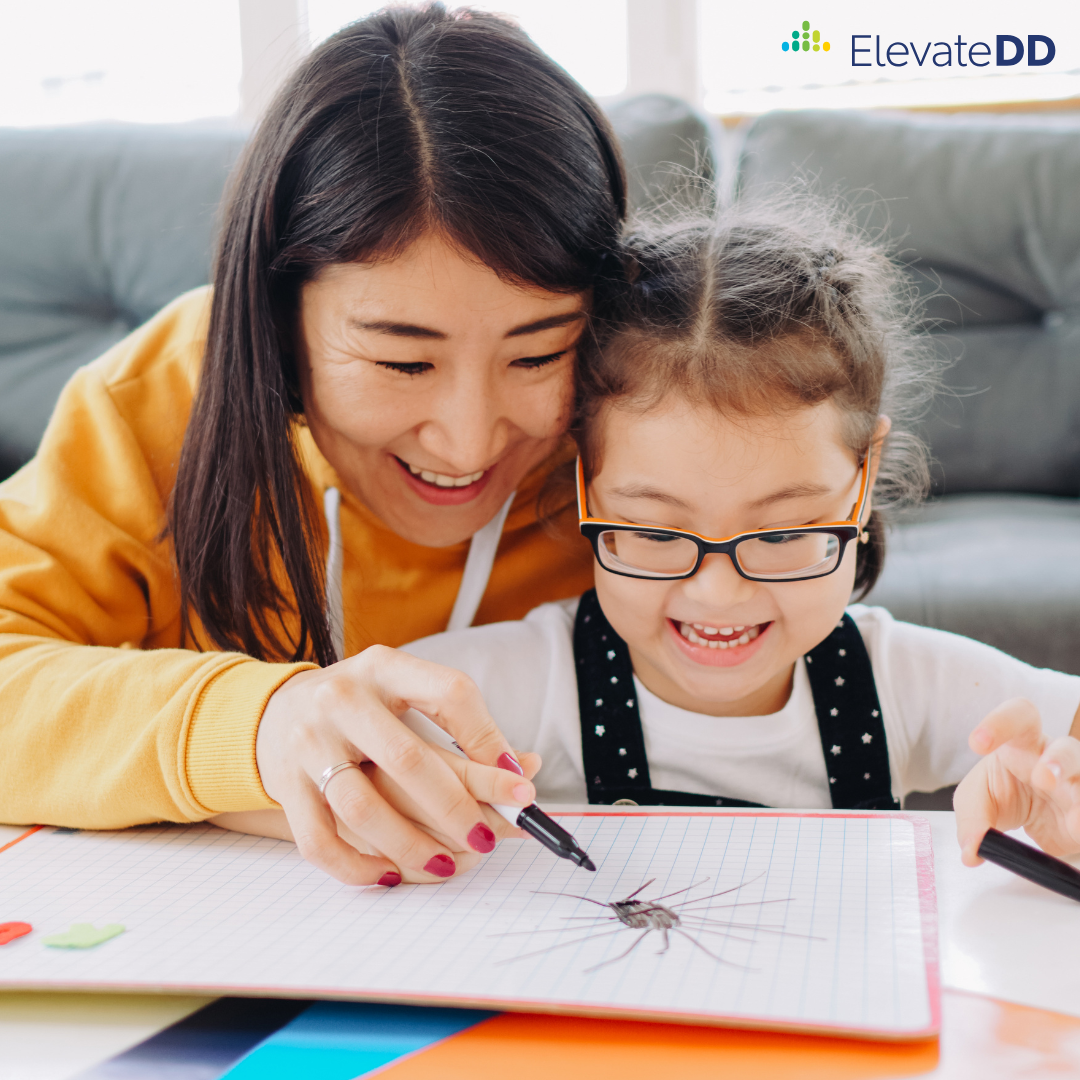 A teacher works with a young student to practice handwriting skills.