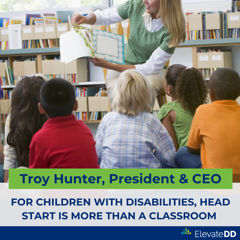 Image is a graphic that shows a teacher holding a book in front of her students, with the author's name and blog post title beneath the image.