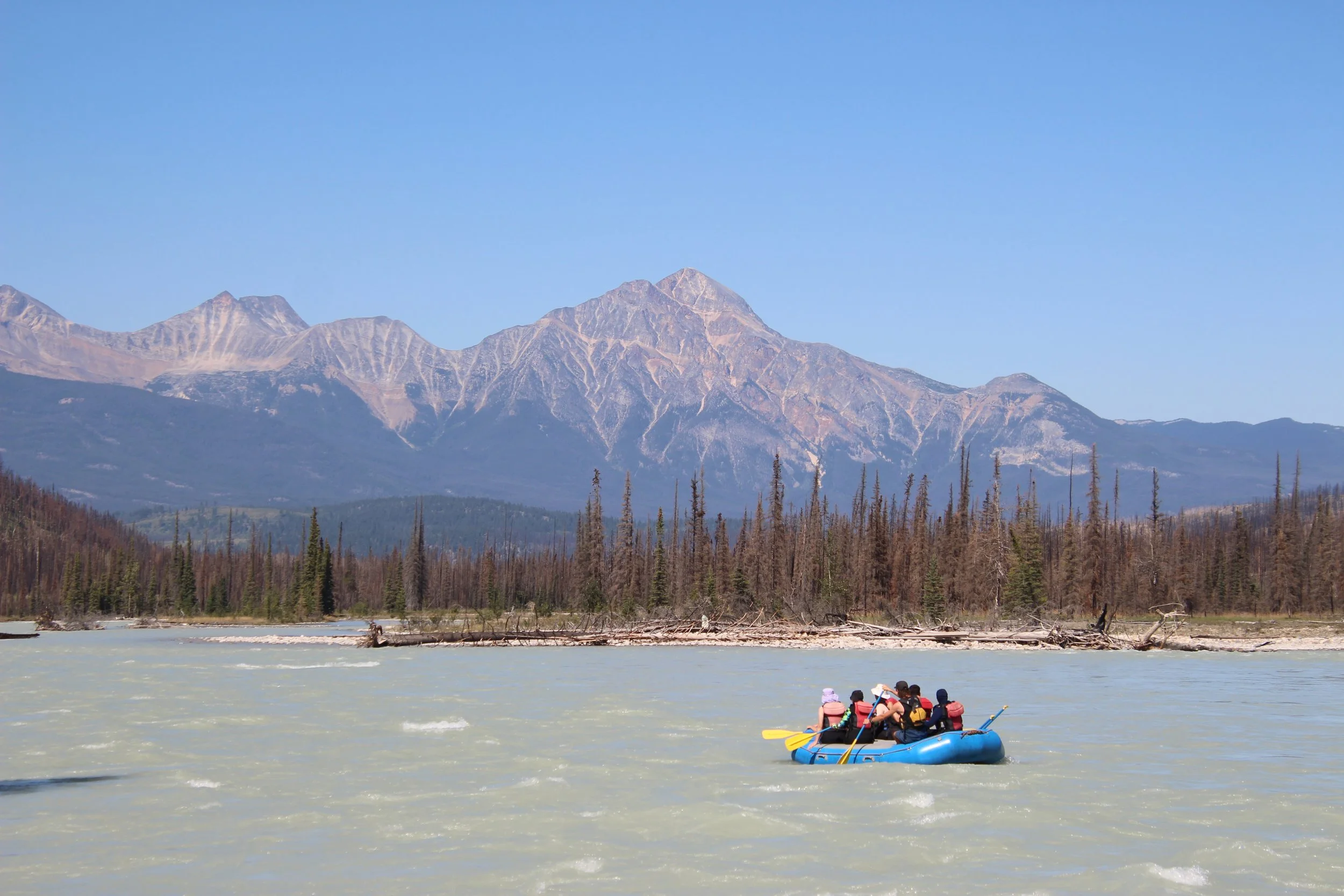 group floating down the rivers and rapdis of jasper alberta