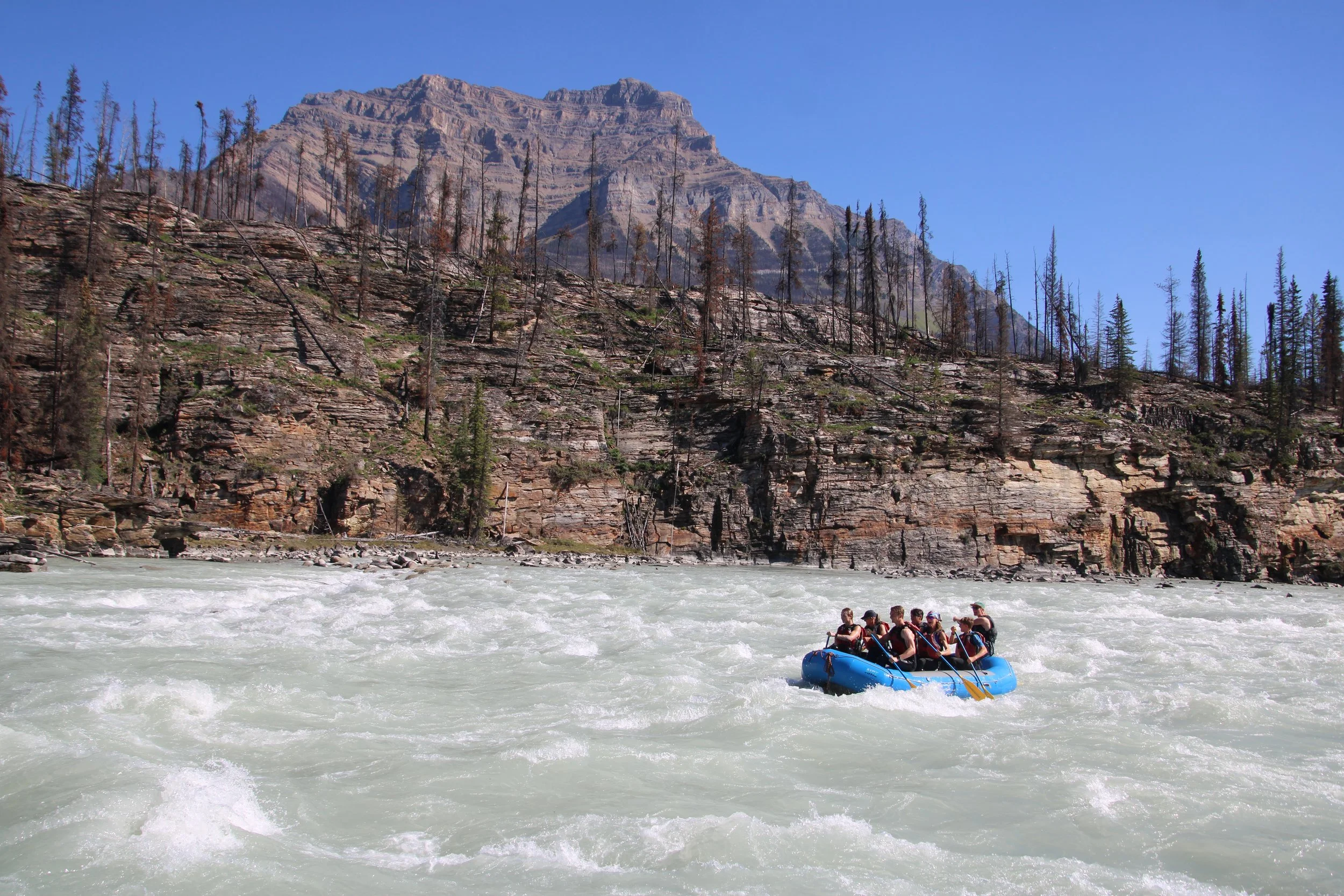 group rafting at the base of athabasca falls beautiful mountain scenery