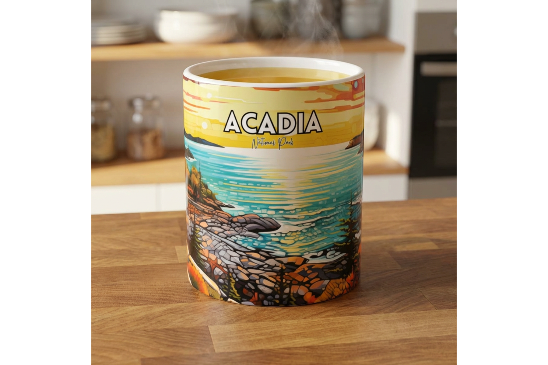 Steaming Acadia National Park mug with colorful sunset shoreline artwork, ocean waves, and rocky coast on a wooden kitchen counter.
