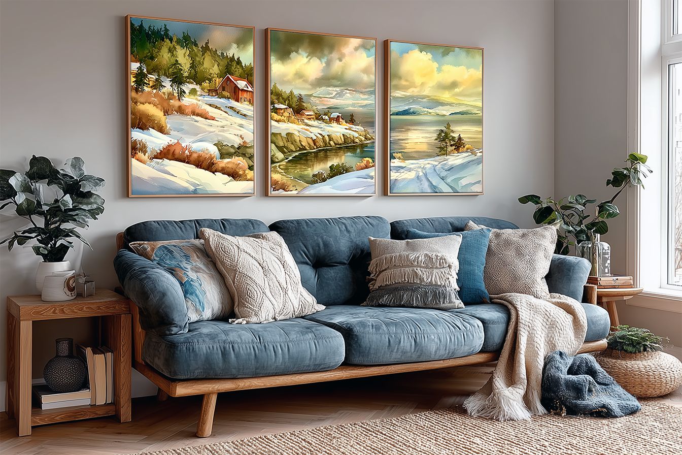 Three framed San Juan Islands Washington watercolor panels above a blue sofa