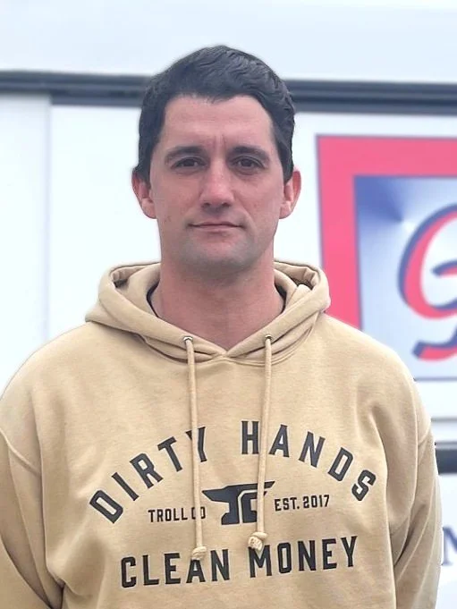 Illustration of a person wearing a cap and a shirt with a logo that reads 'Mechanical.'