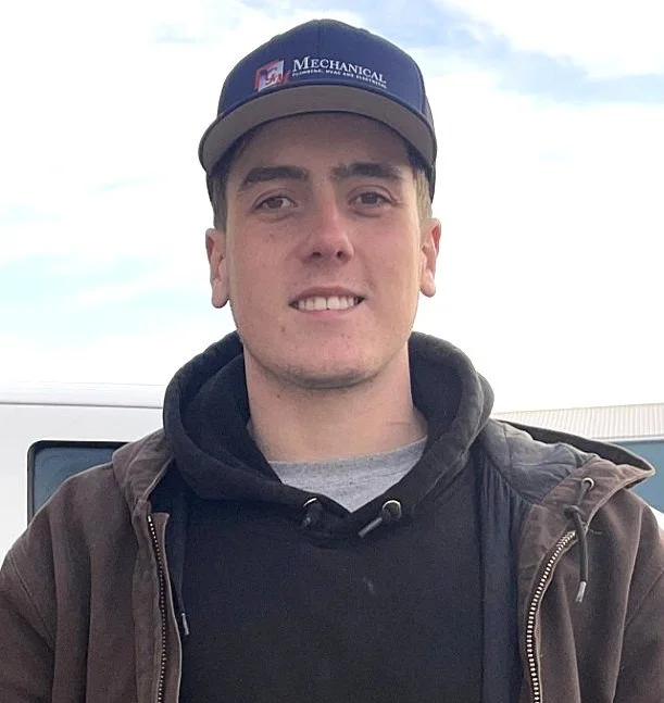 Line drawing of a person wearing a cap and a polo shirt with a company logo for Mechanical Plumbing HVAC and Electrical.