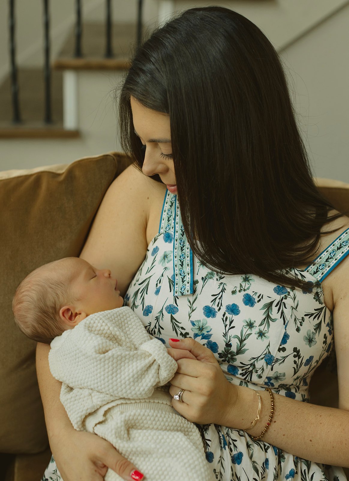 Mother and child sharing a candid moment during an at-home family photo session in Louisiana.