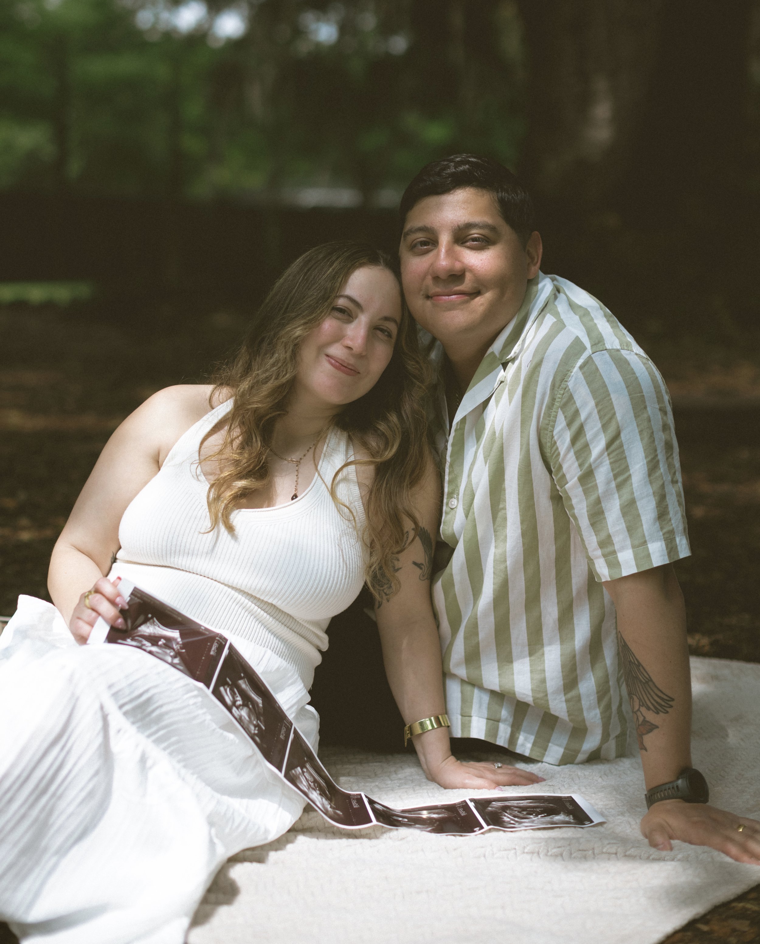 New Orleans maternity photography session documenting pregnancy and connection outdoors.