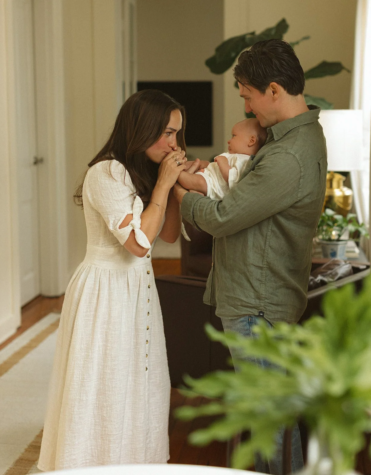 Lifestyle newborn photographer in New Orleans documenting genuine connection between parents and their baby.