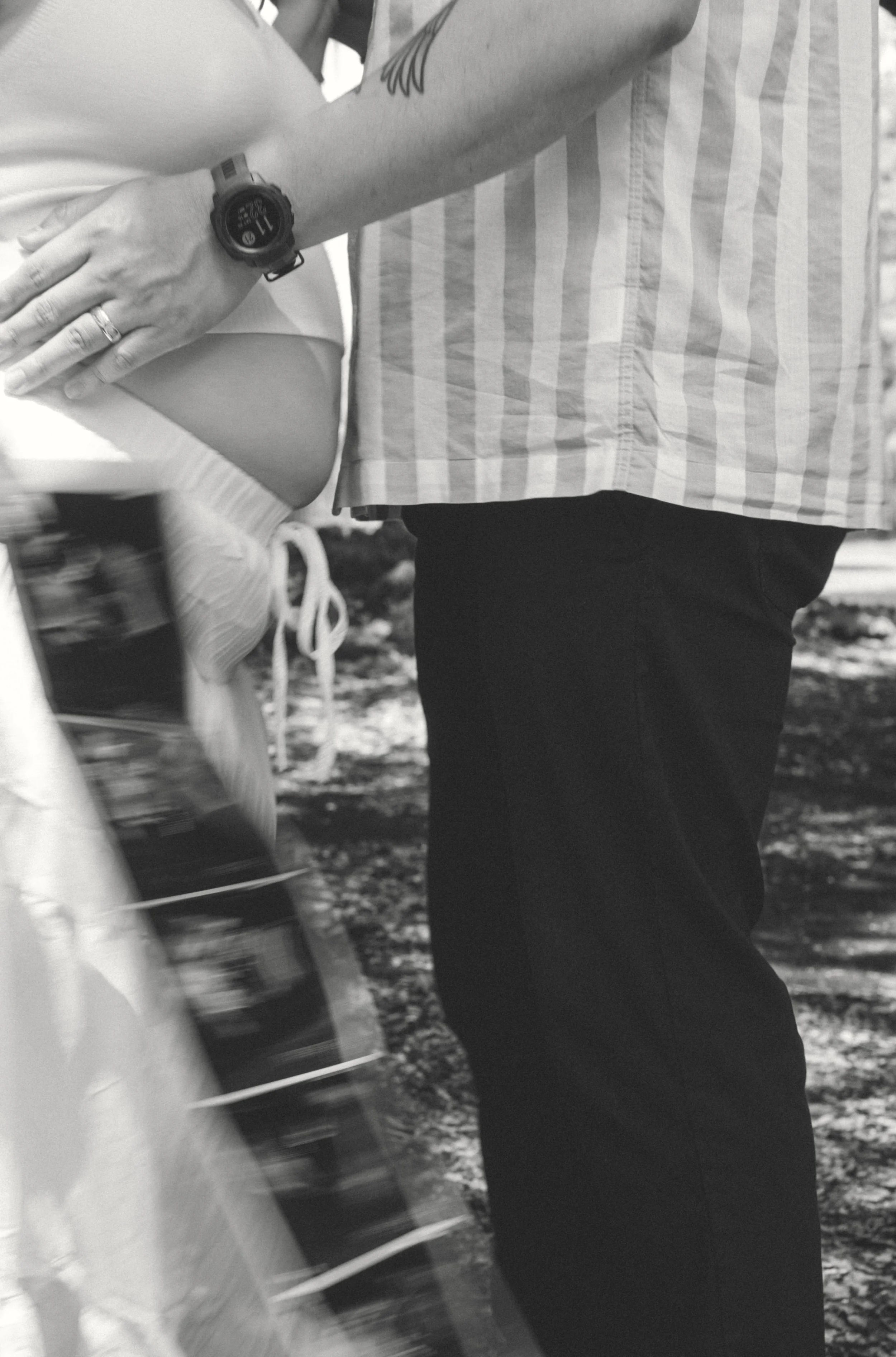 Close-up image of expecting mom holding ultrasound photos during a New Orleans maternity session in Audubon Park.