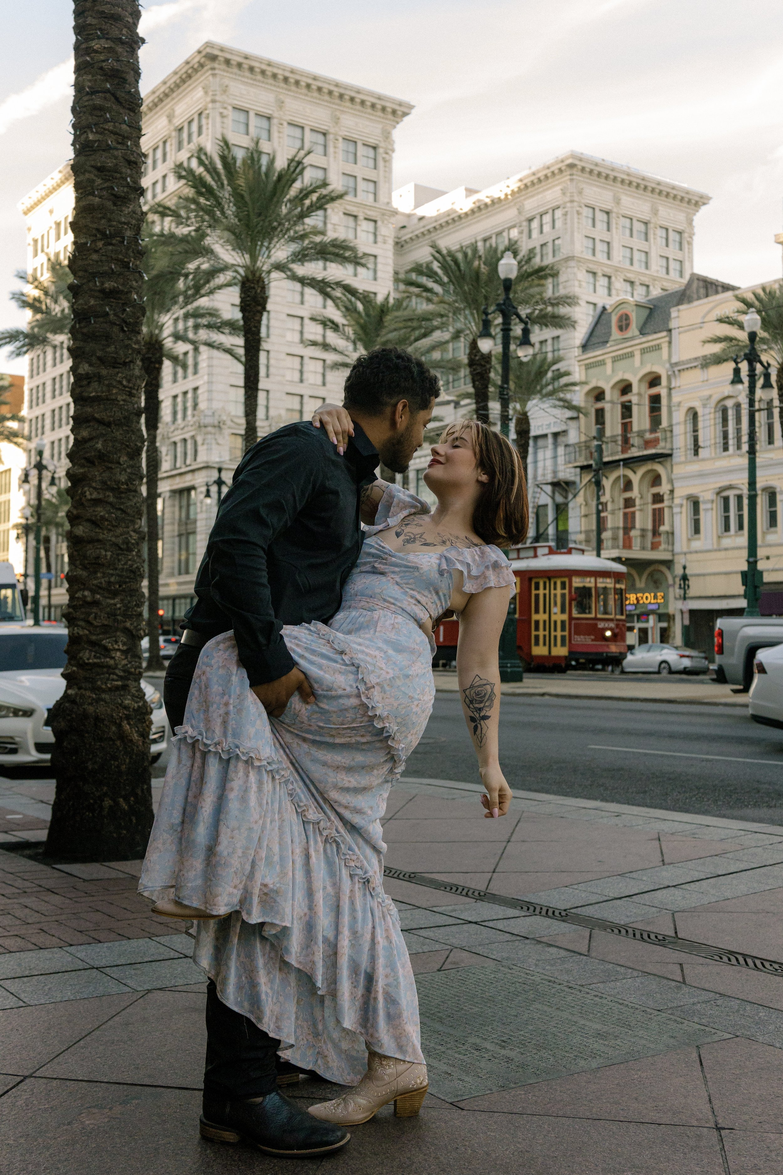 Couple embracing one another on Canal Street In New Orleans. 