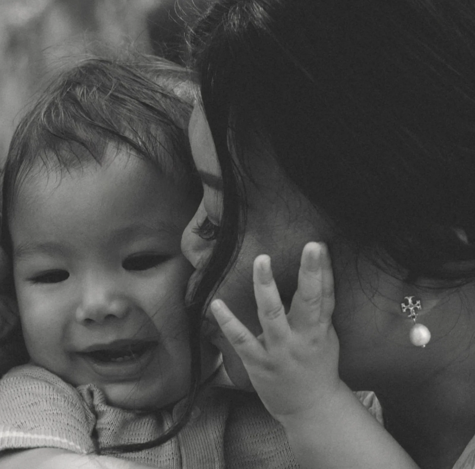 Mother embracing her son during a motherhood session in Lakeshore New Orleans