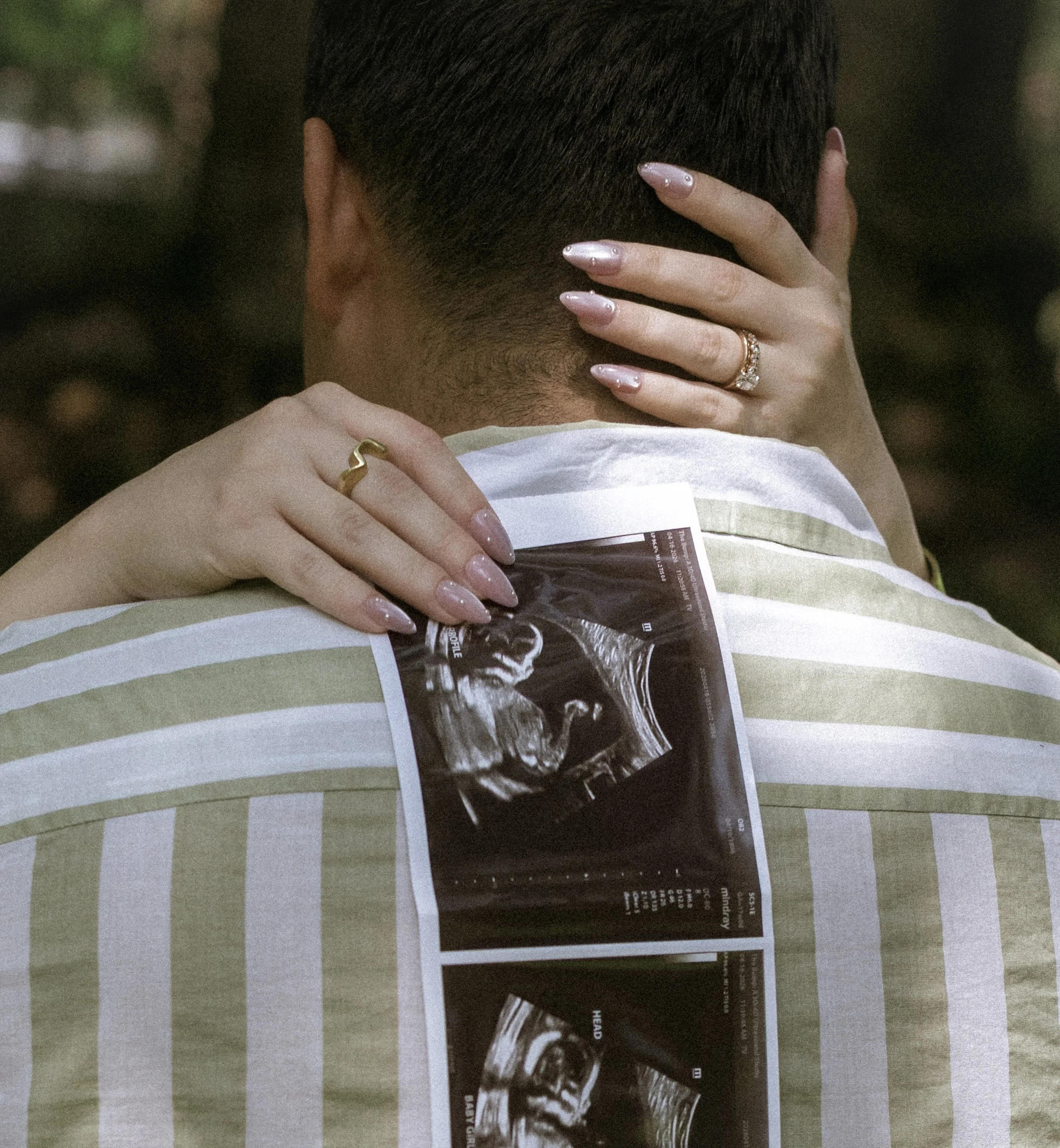 Documentary-style maternity session featuring expecting couple in natural light.