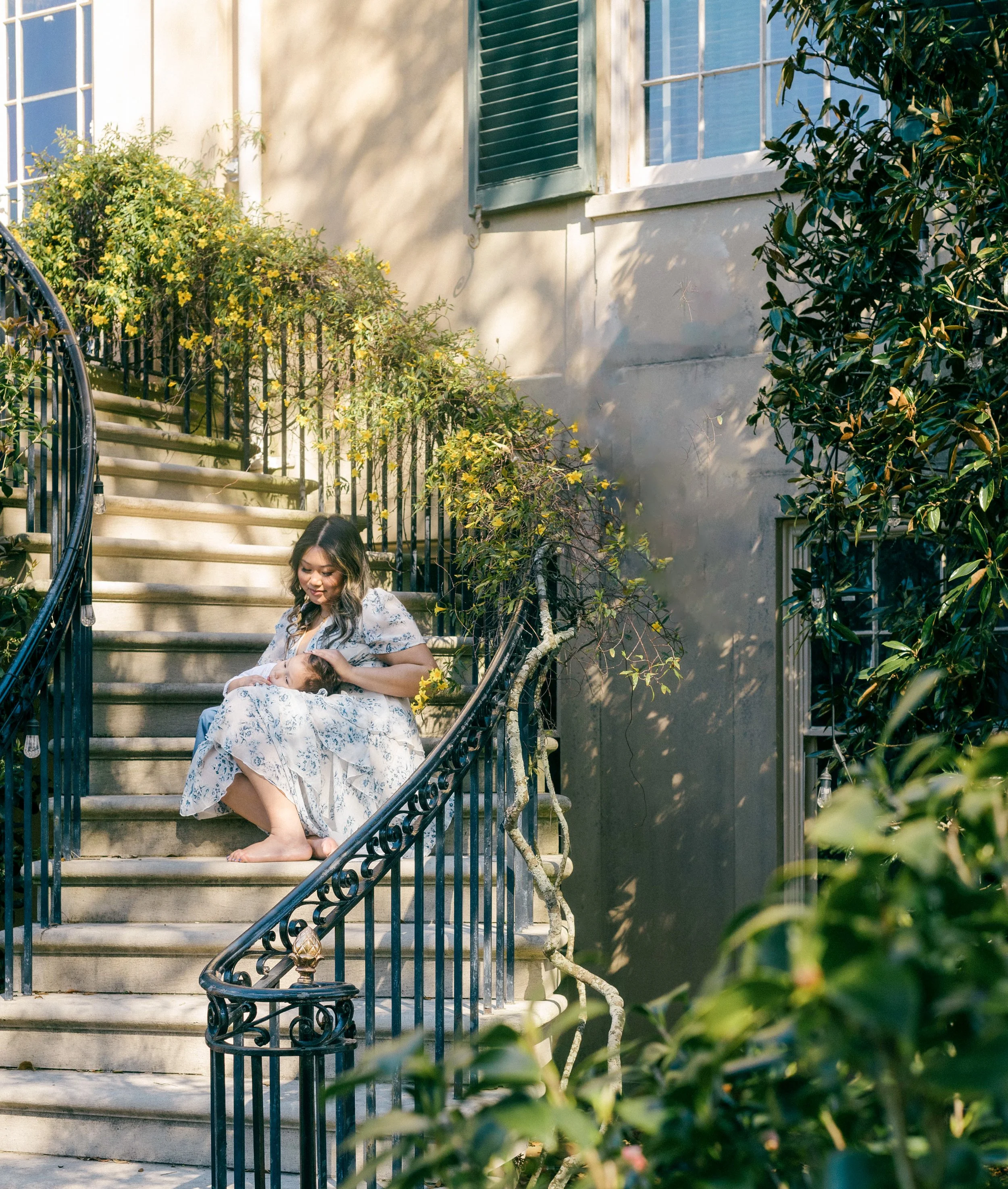 Quiet mother and toddler portrait surrounded by greenery at Longue Vue Gardens.